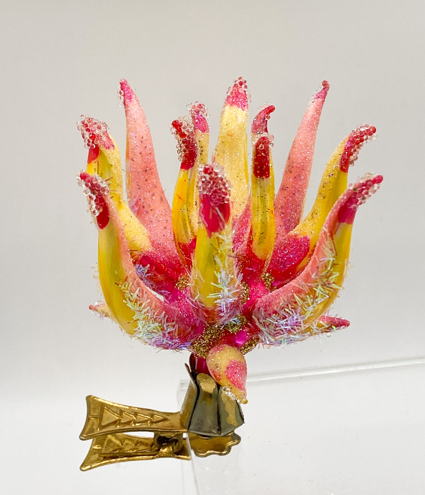Exotic, filigree flower on clip