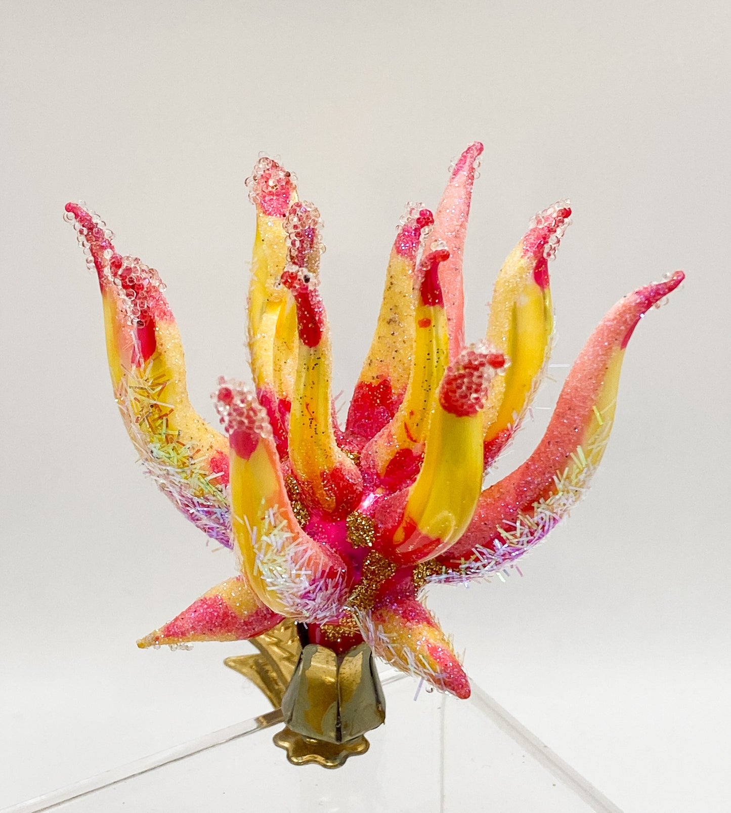 Exotic, filigree flower on clip