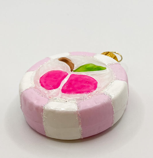 Rosa Bonbon mit Apfel-Motiv