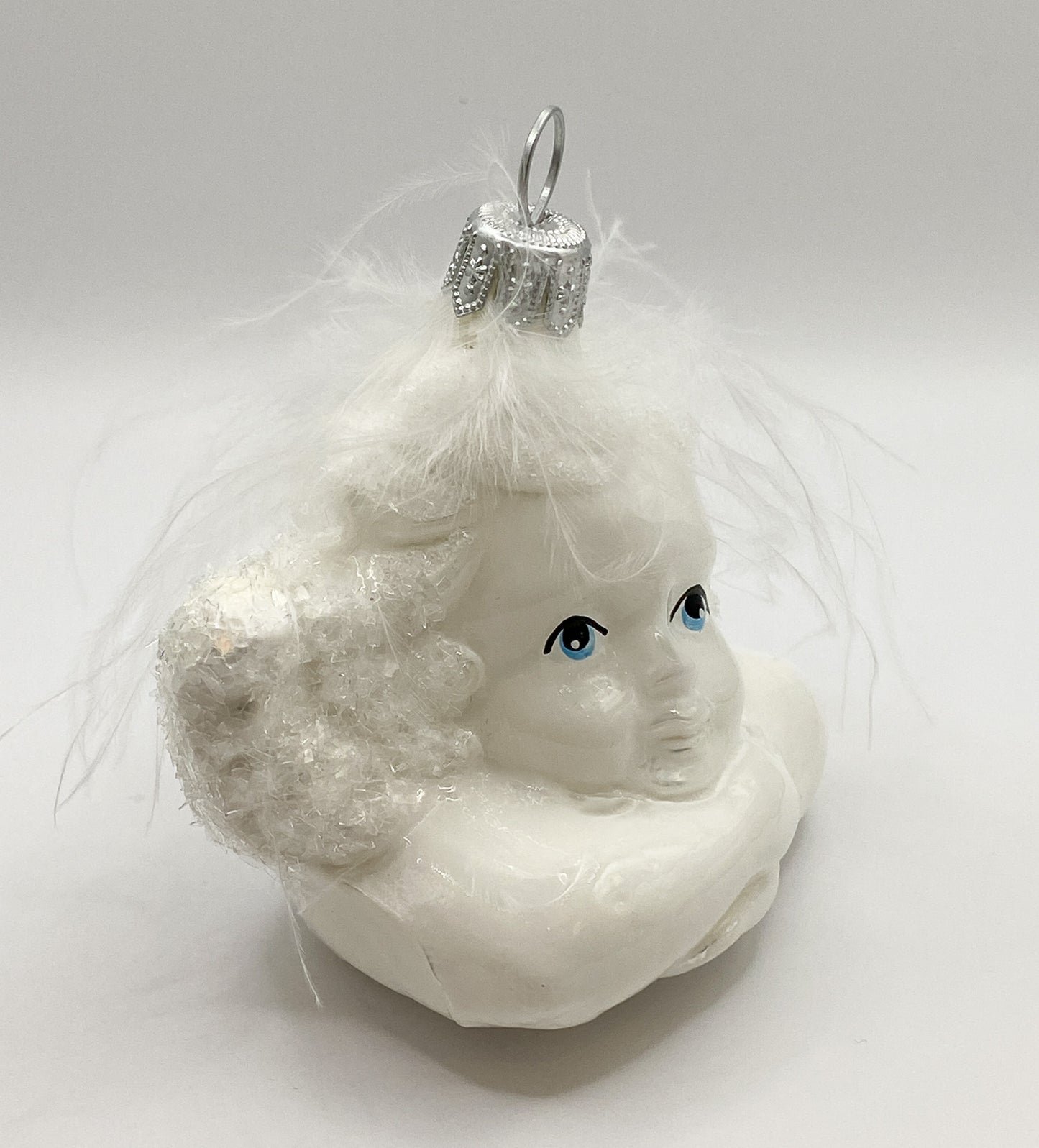 Putto in shiny white with glitter wings, Raffael Angel