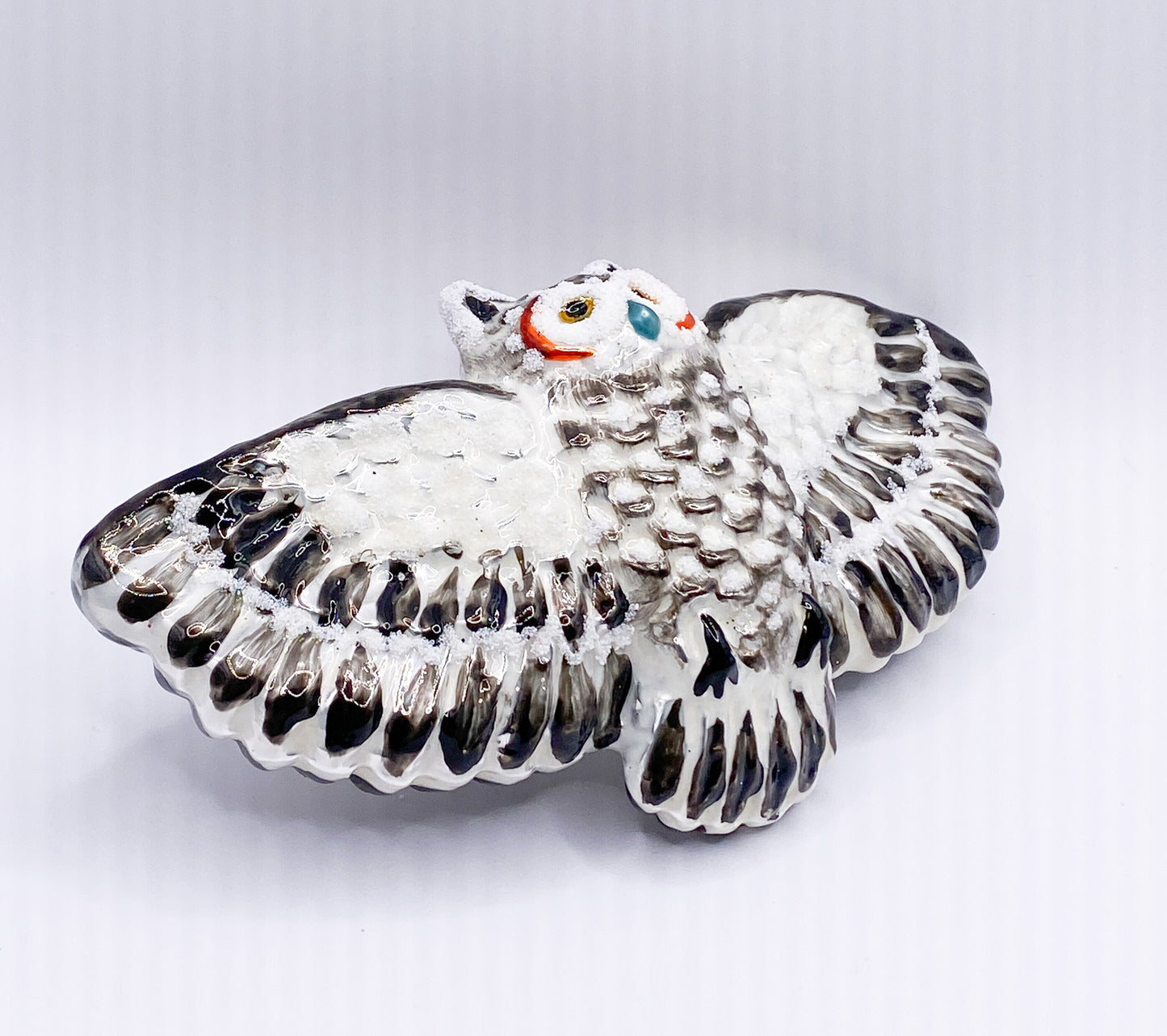 Flying white-grey owl