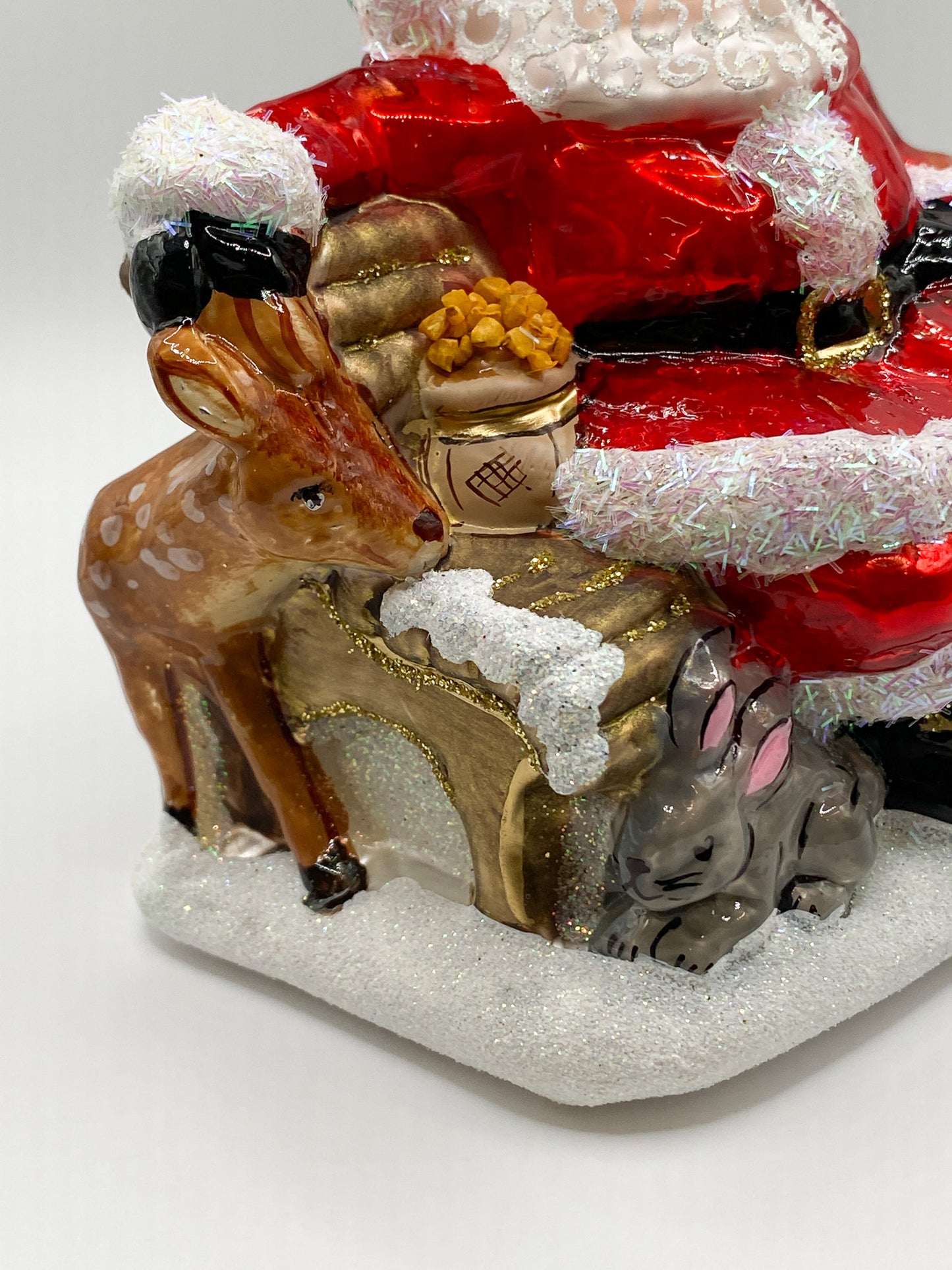 Santa on the park bench with the forest animals