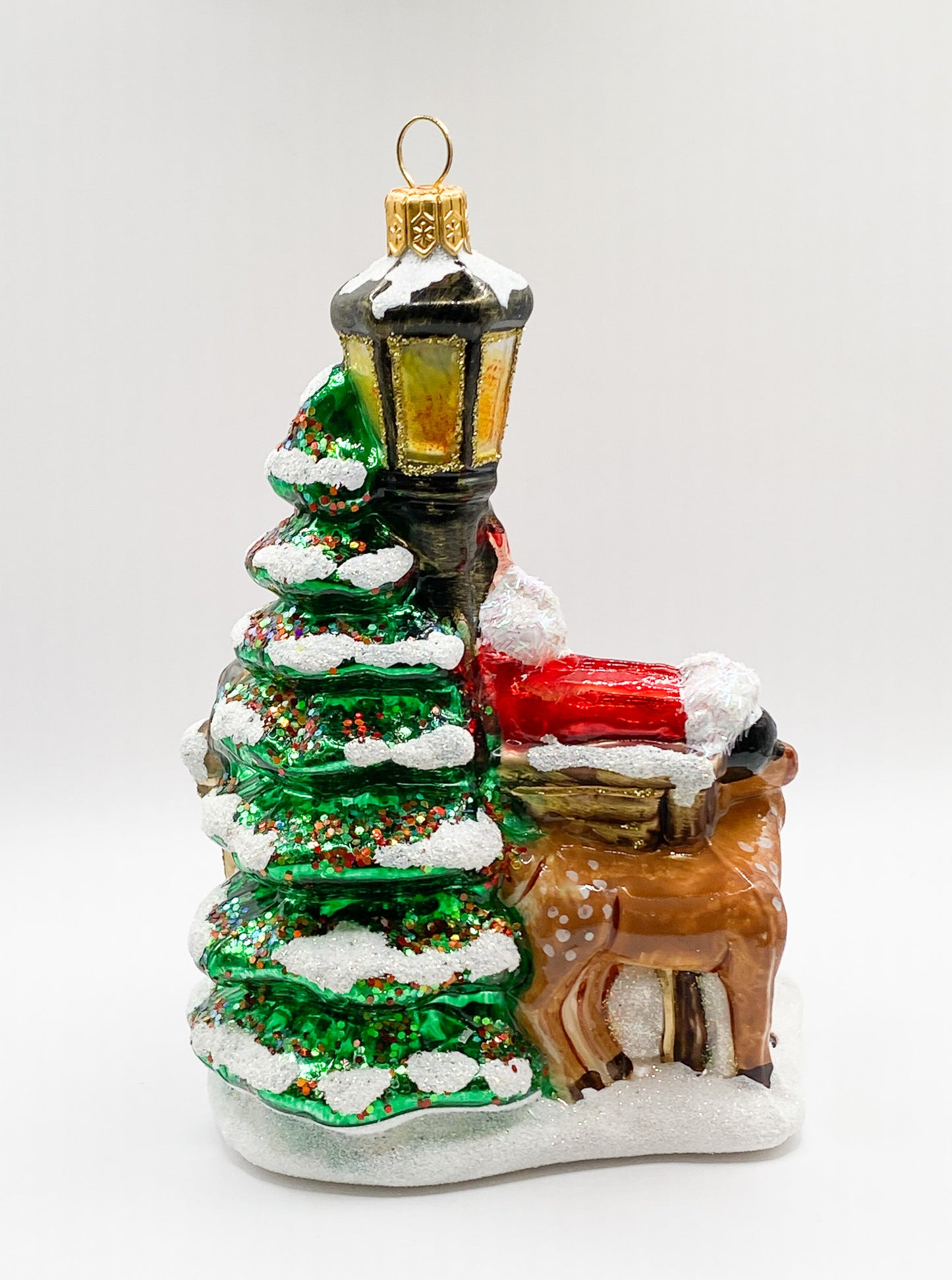 Santa on the park bench with the forest animals