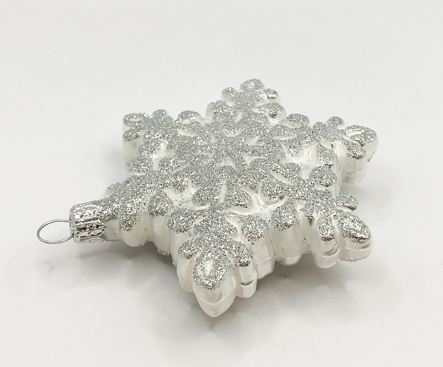 White snowflake with silver glitter