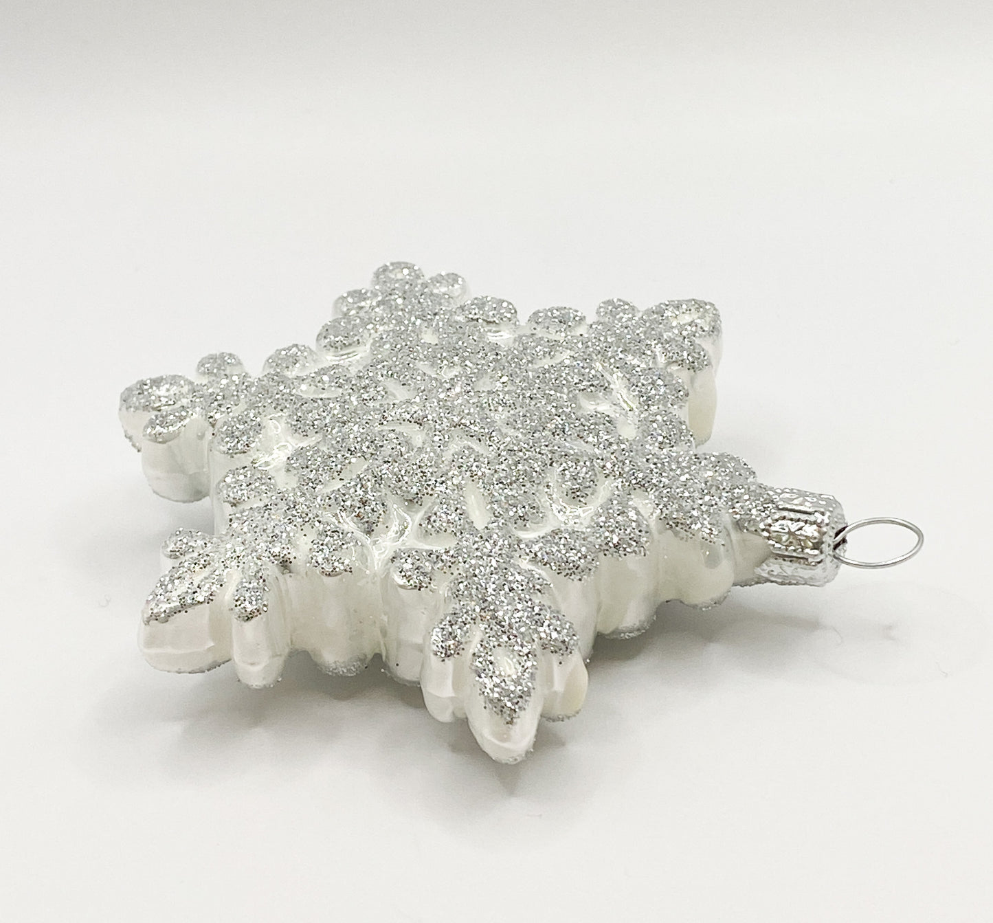 White snowflake with silver glitter
