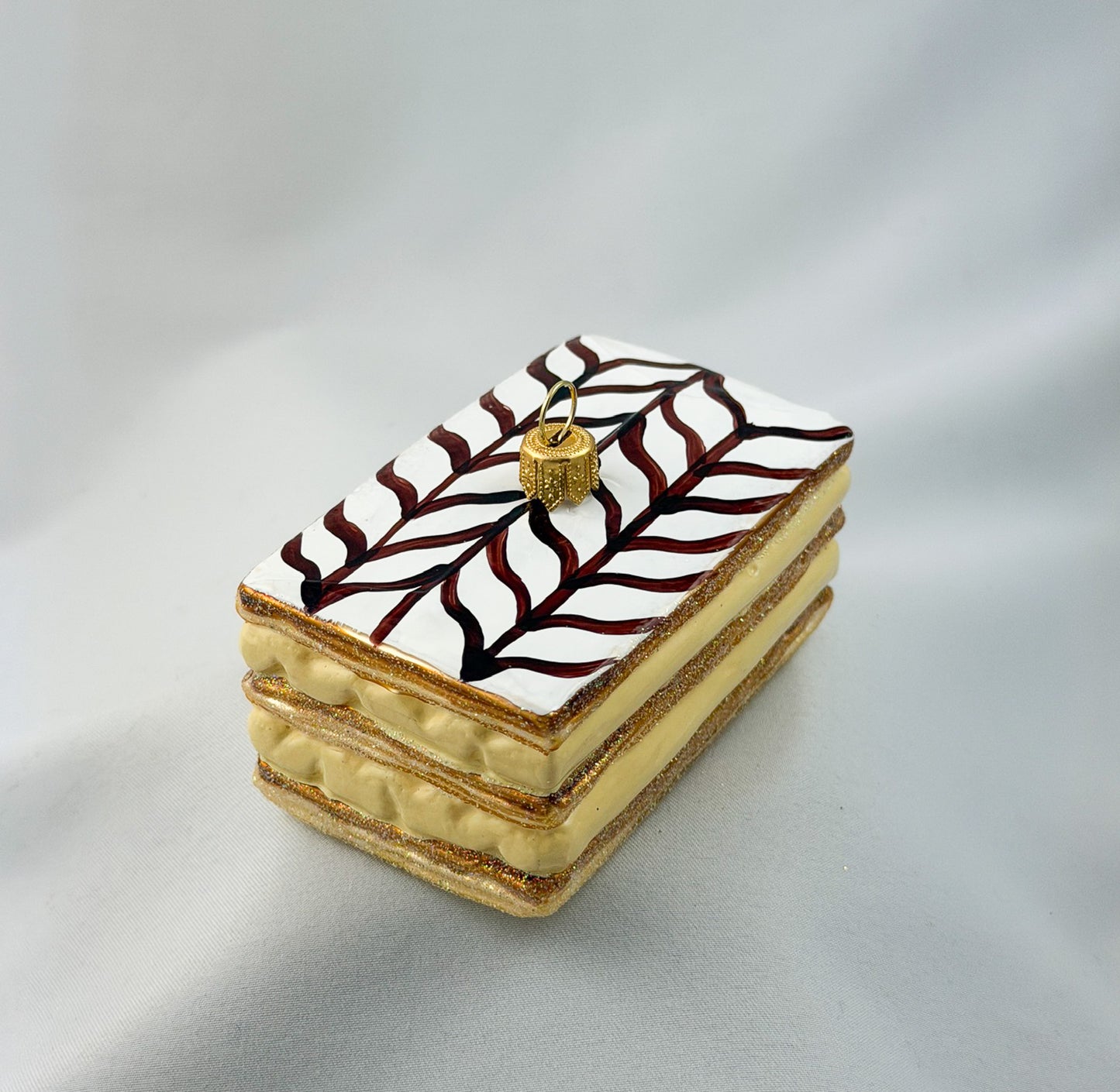 Cream slice with icing and chocolate decoration