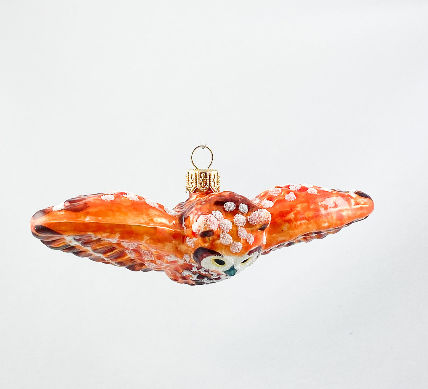 Fliegende rostbraune Eule