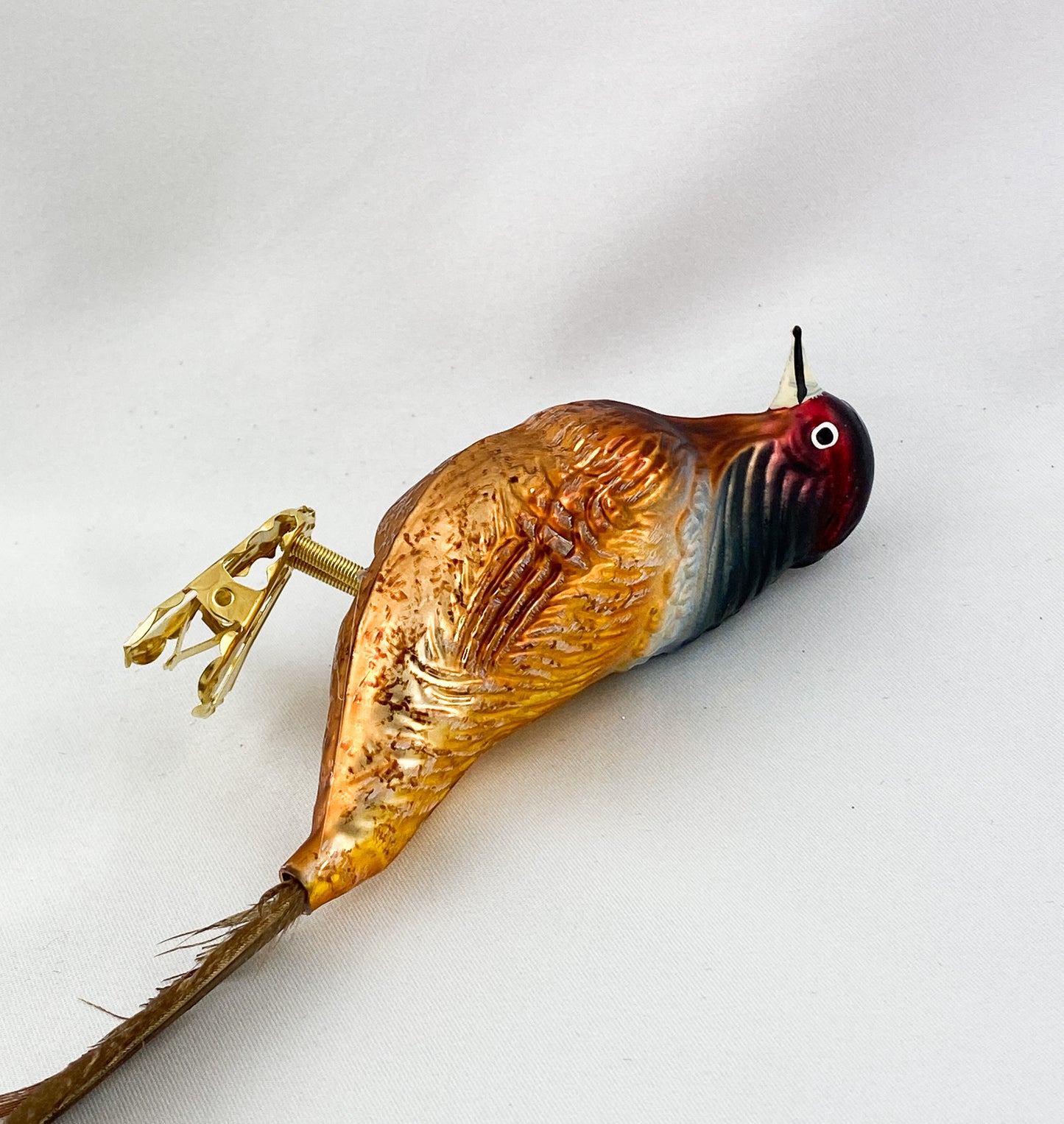 Hunting pheasant with long pheasant feather on clip