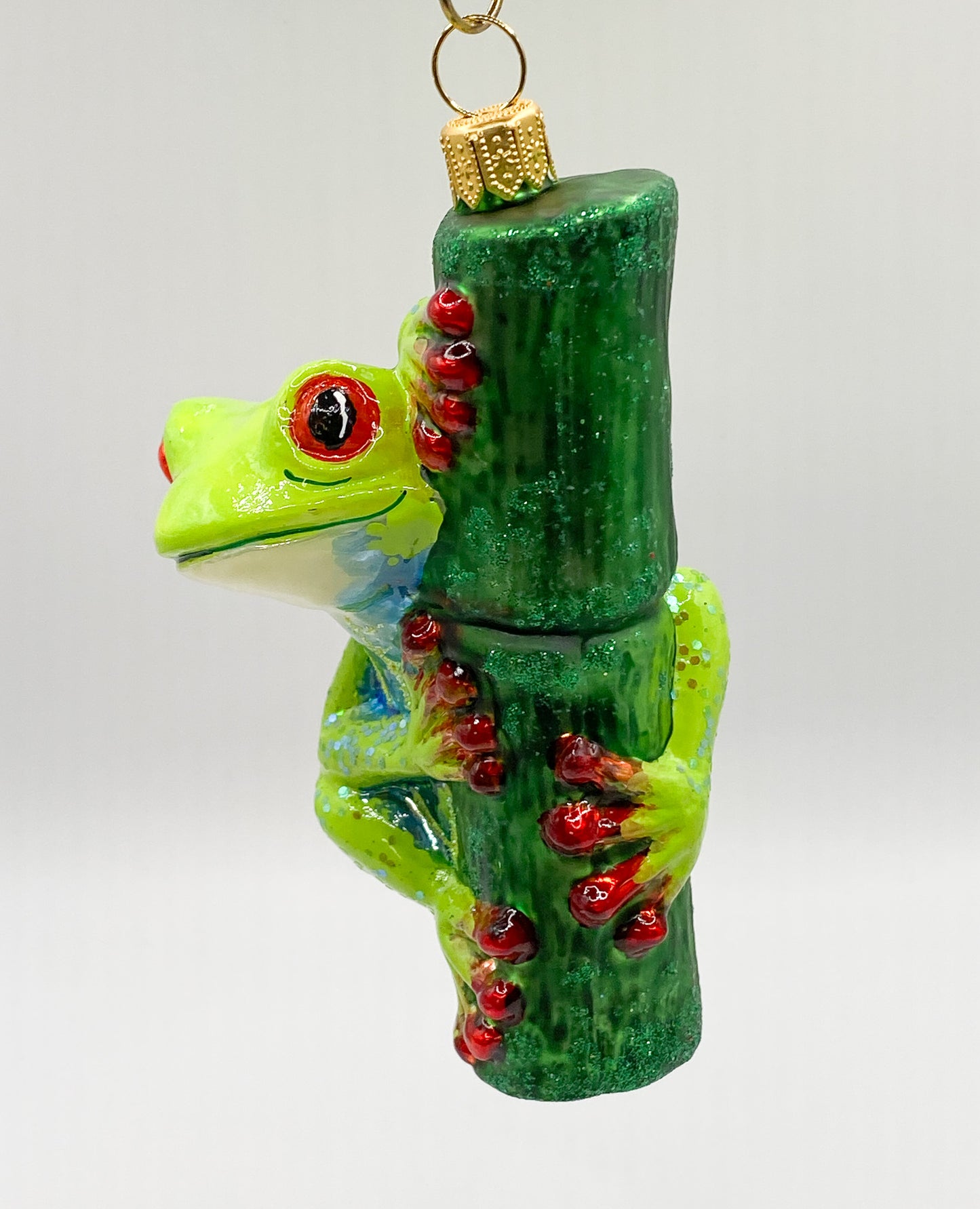 Funny frog on a blade of grass