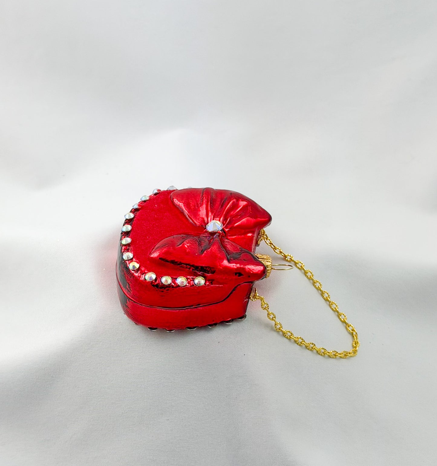 Red women's handbag with bow and glitter stones