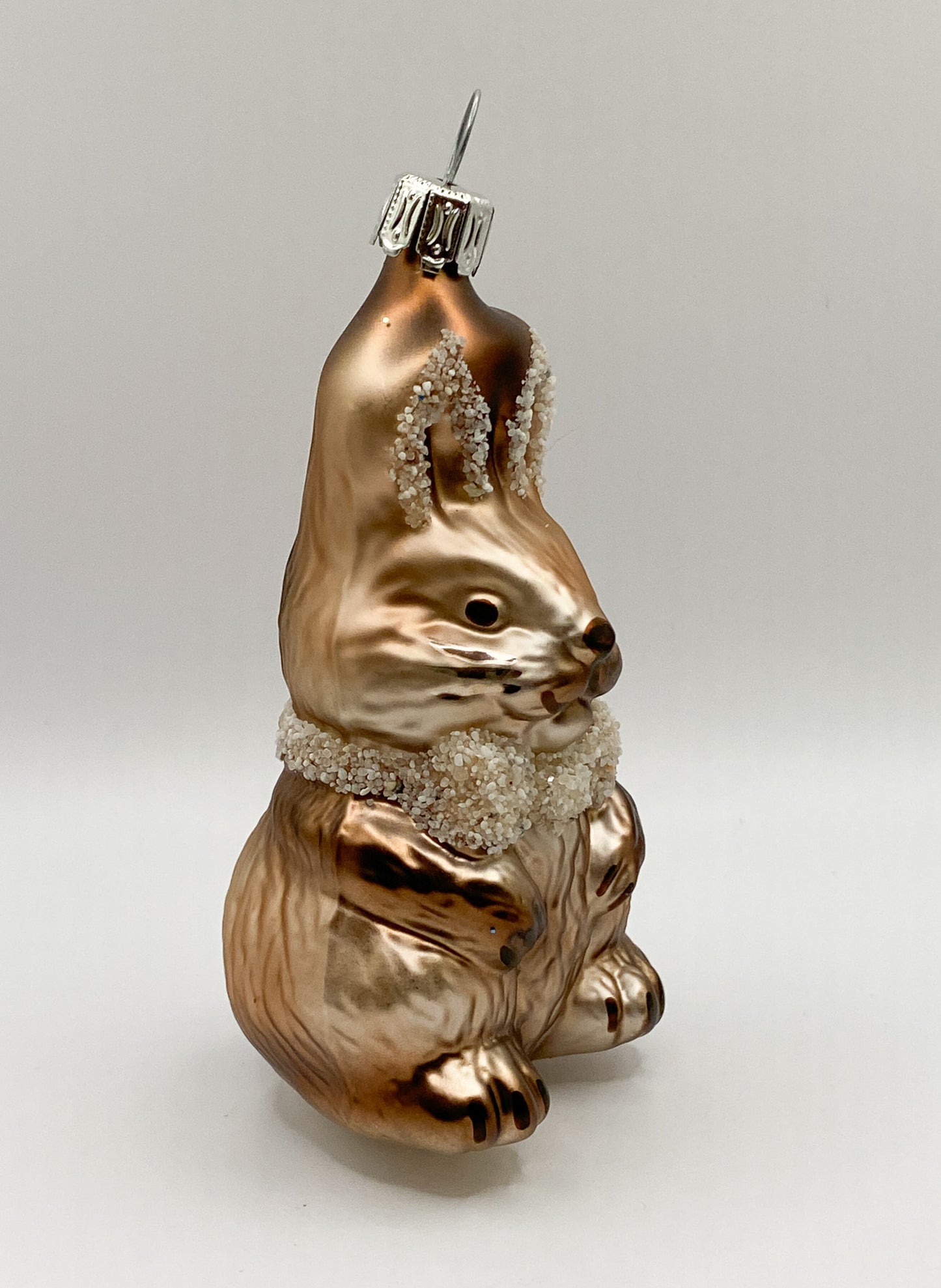 Sitting brown bunny with ribbon