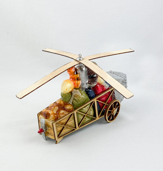 Santa Claus transports the hazelnuts for the squirrel by helicopter AtlasArt