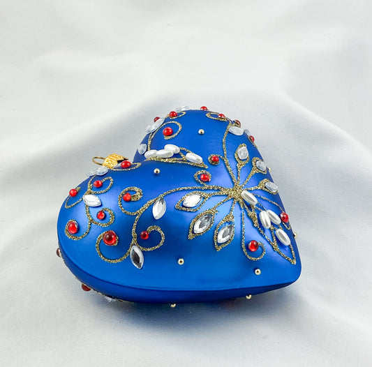 Blue heart with pearls and red gemstones