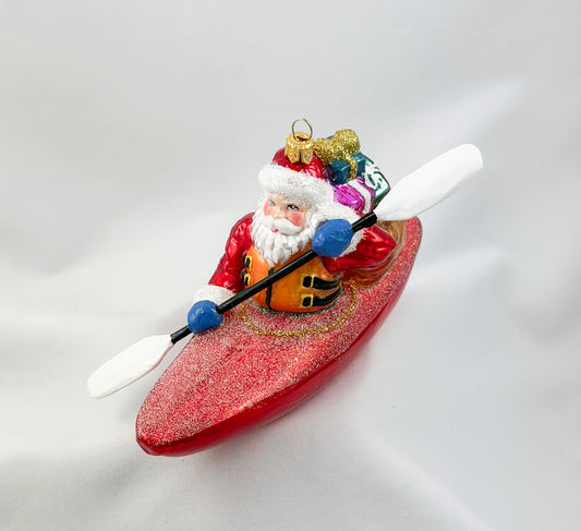 Santa Claus brings the presents by kayak