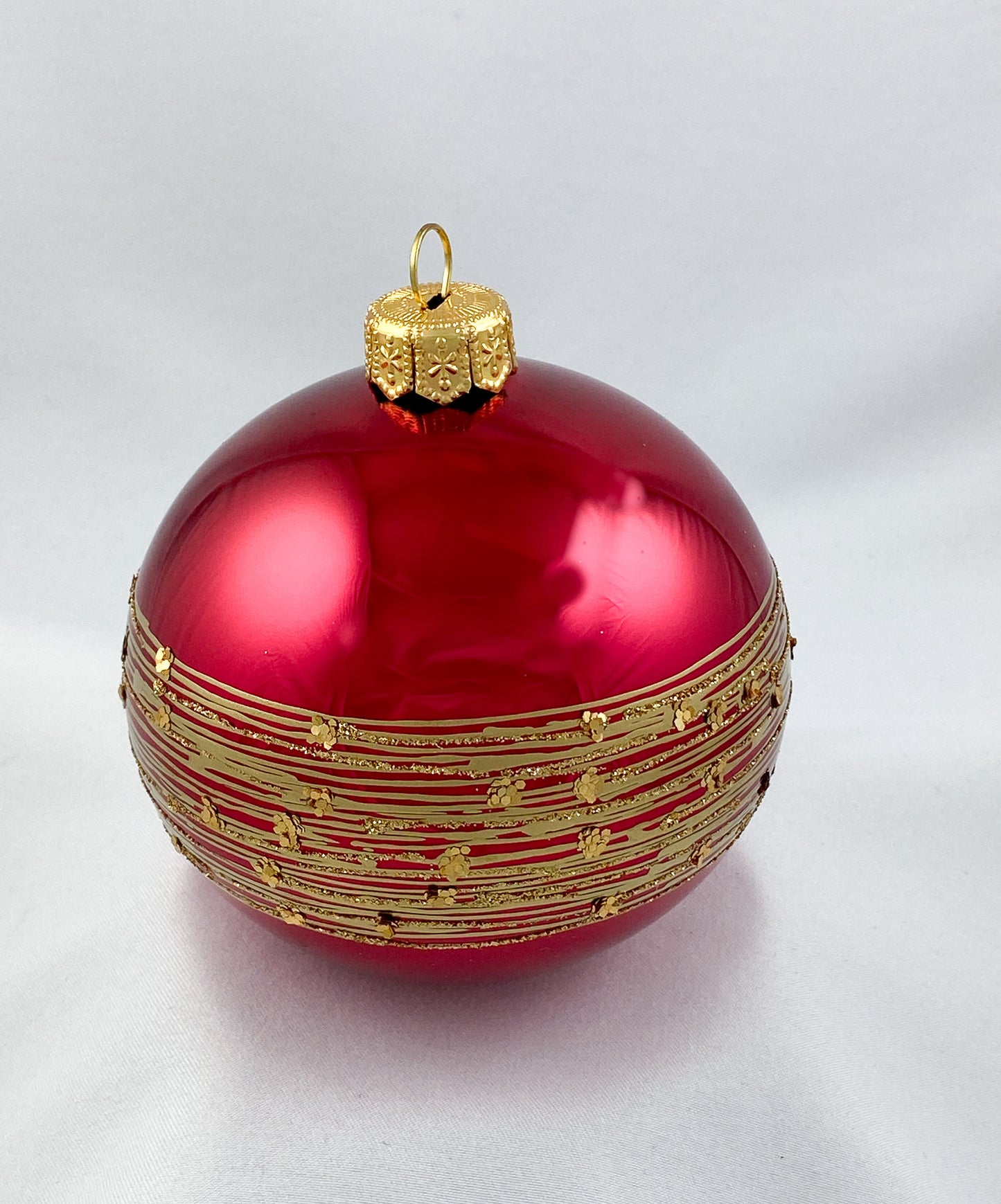 Ball dark shiny magenta with golden stripe decoration
