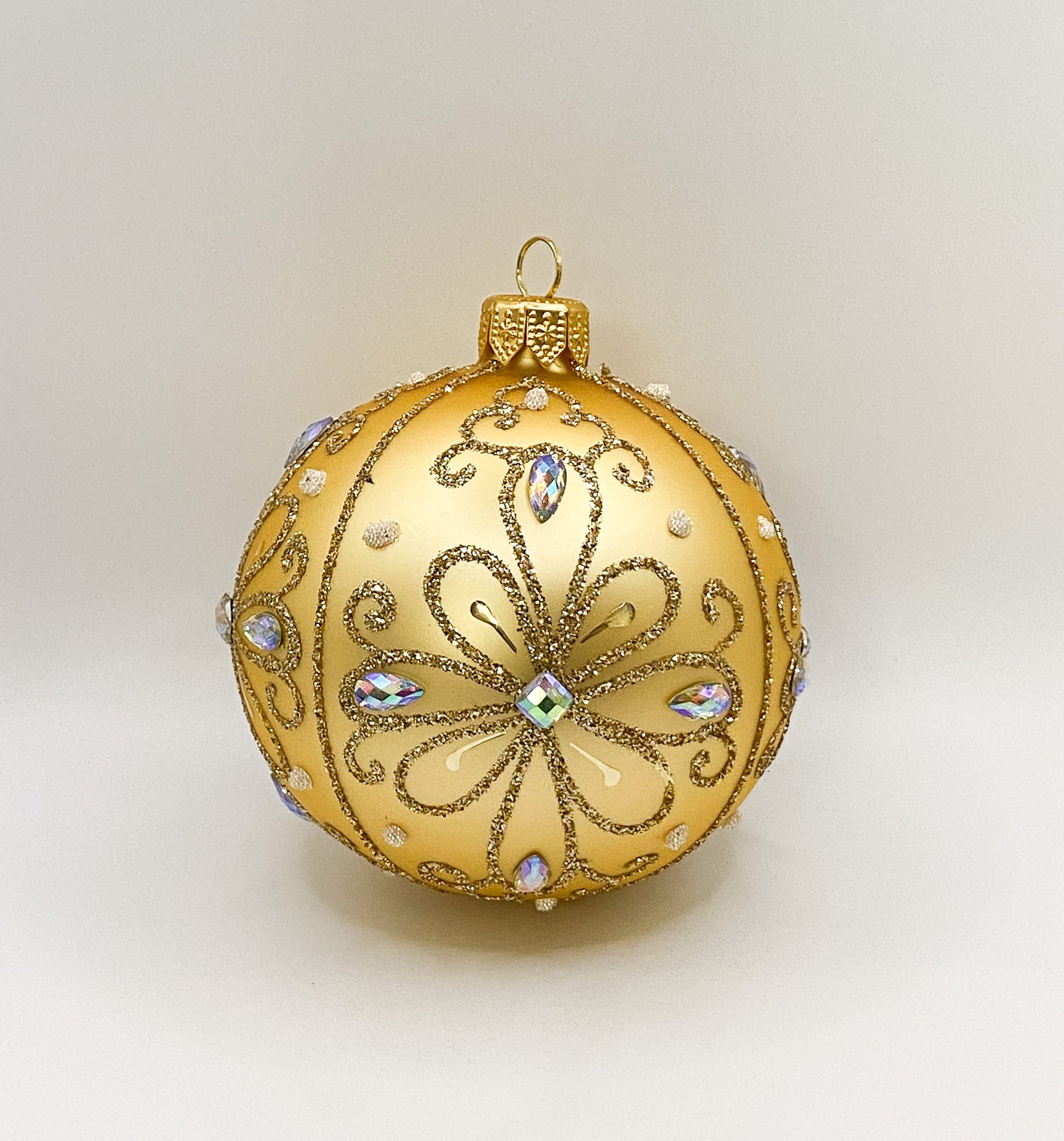 Ball gold matt with stylized flower motif
