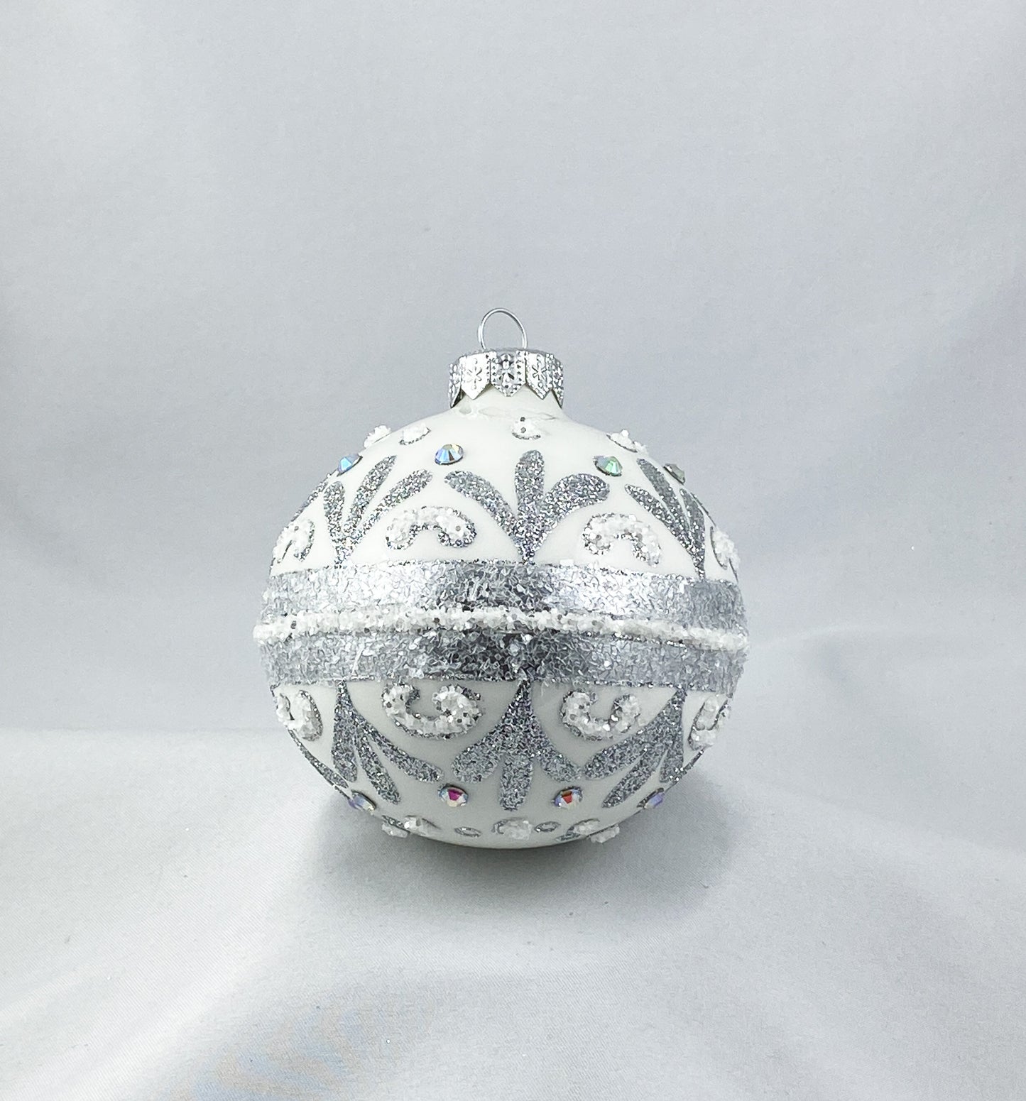 White ball with stylized leaves and rocaille motif