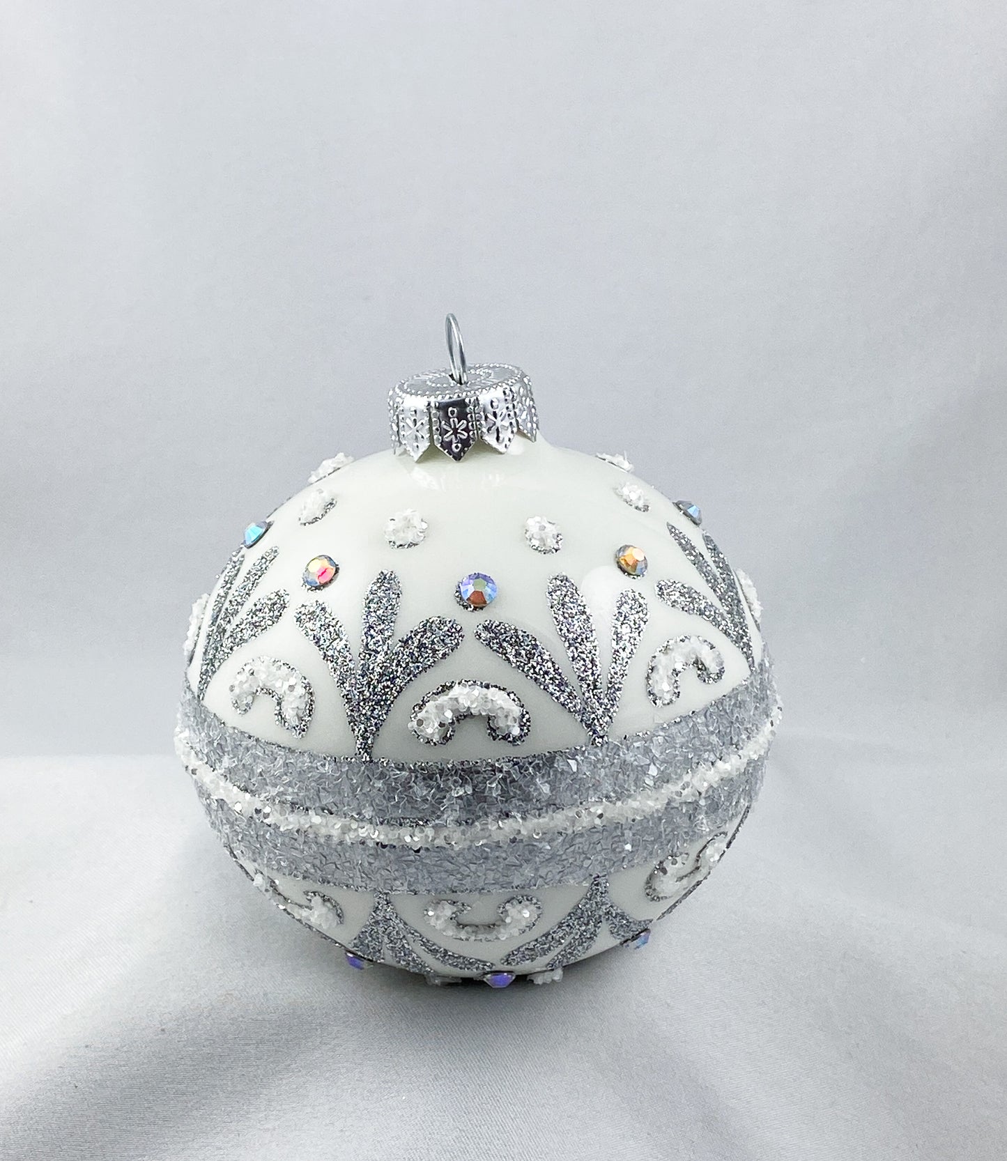 White ball with stylized leaves and rocaille motif