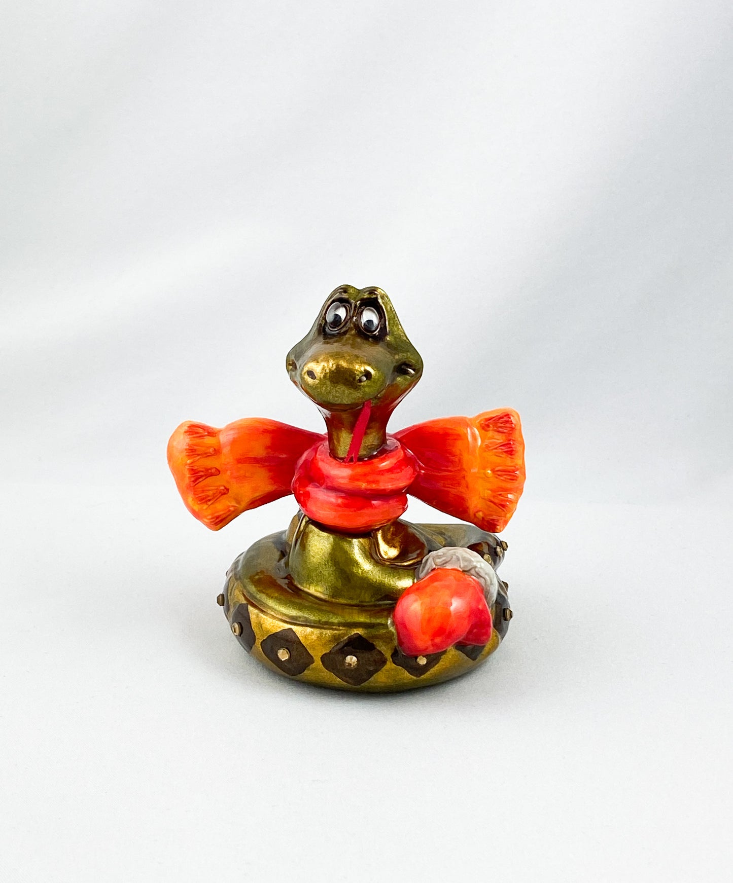 Schlange mit orangem Schal, AtlasArt