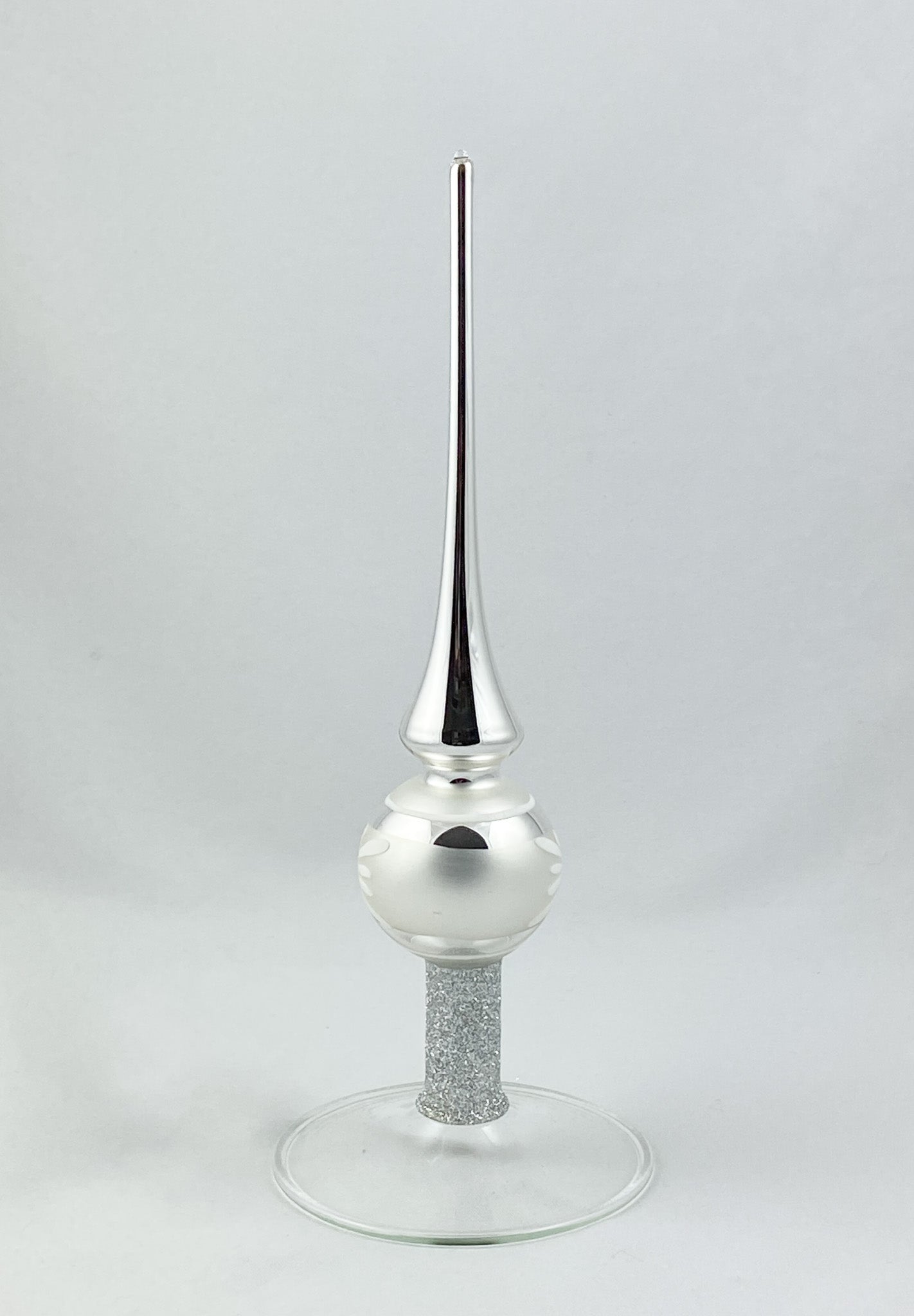 Silver tree topper with white flower motif