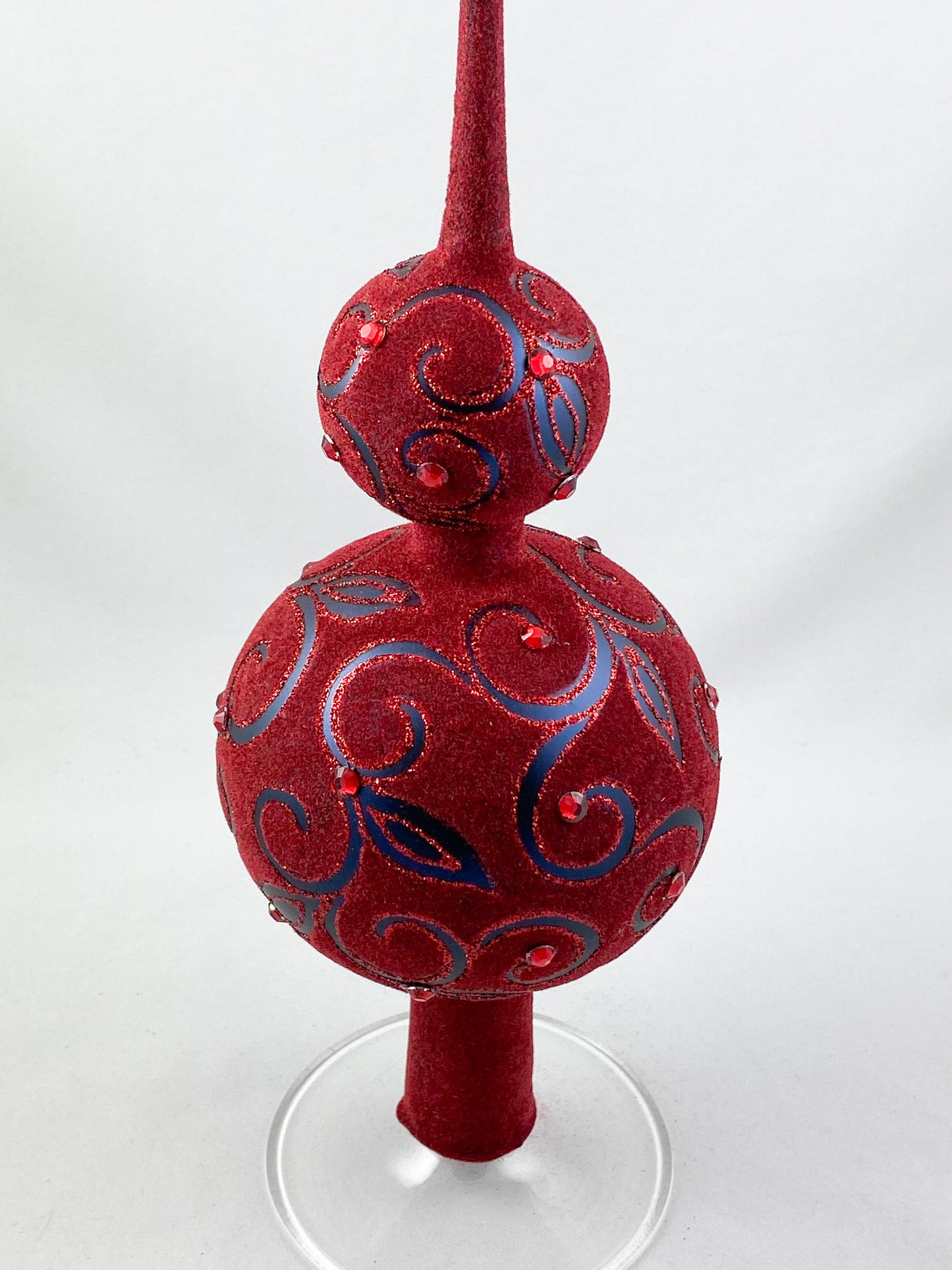 Velvety dark red Christmas tree topper with tendril motif