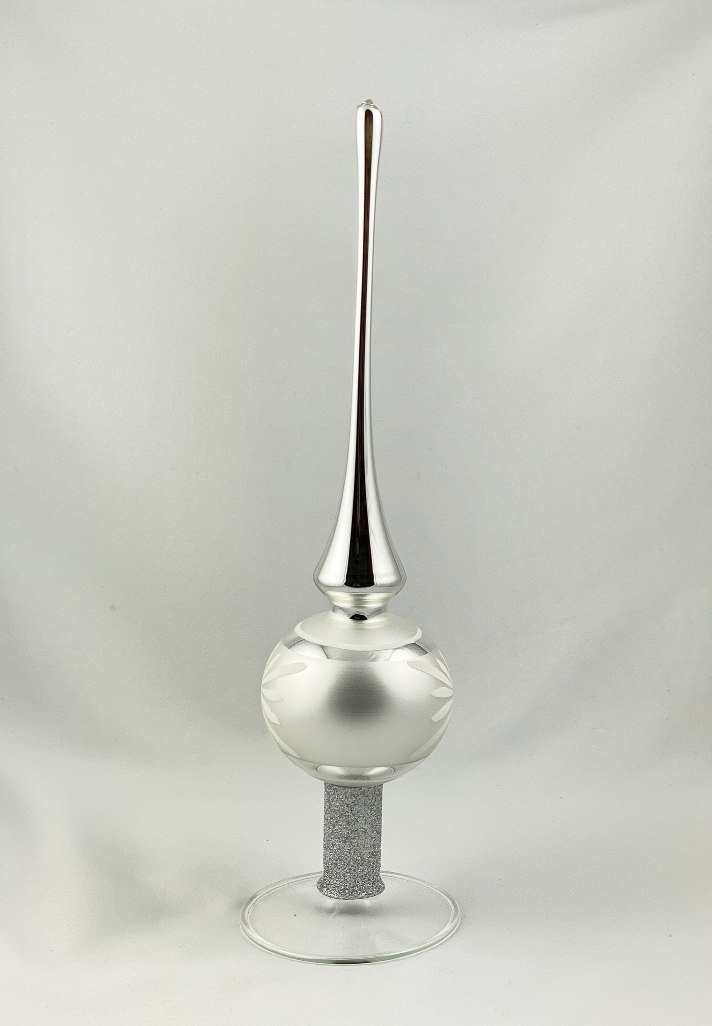 Silver tree topper with white flower motif