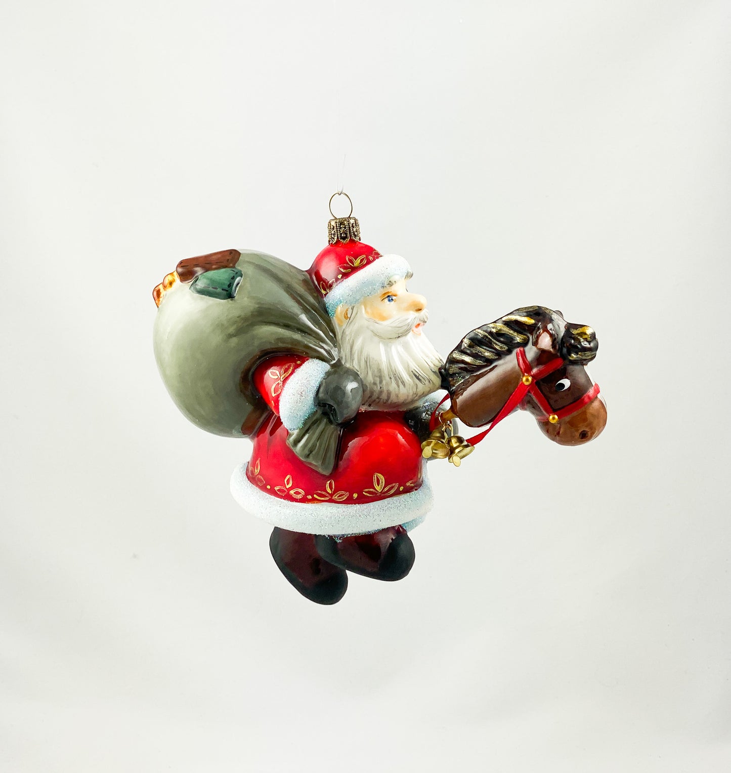 Father Frost brings the gifts with his stick horse AtlasArt