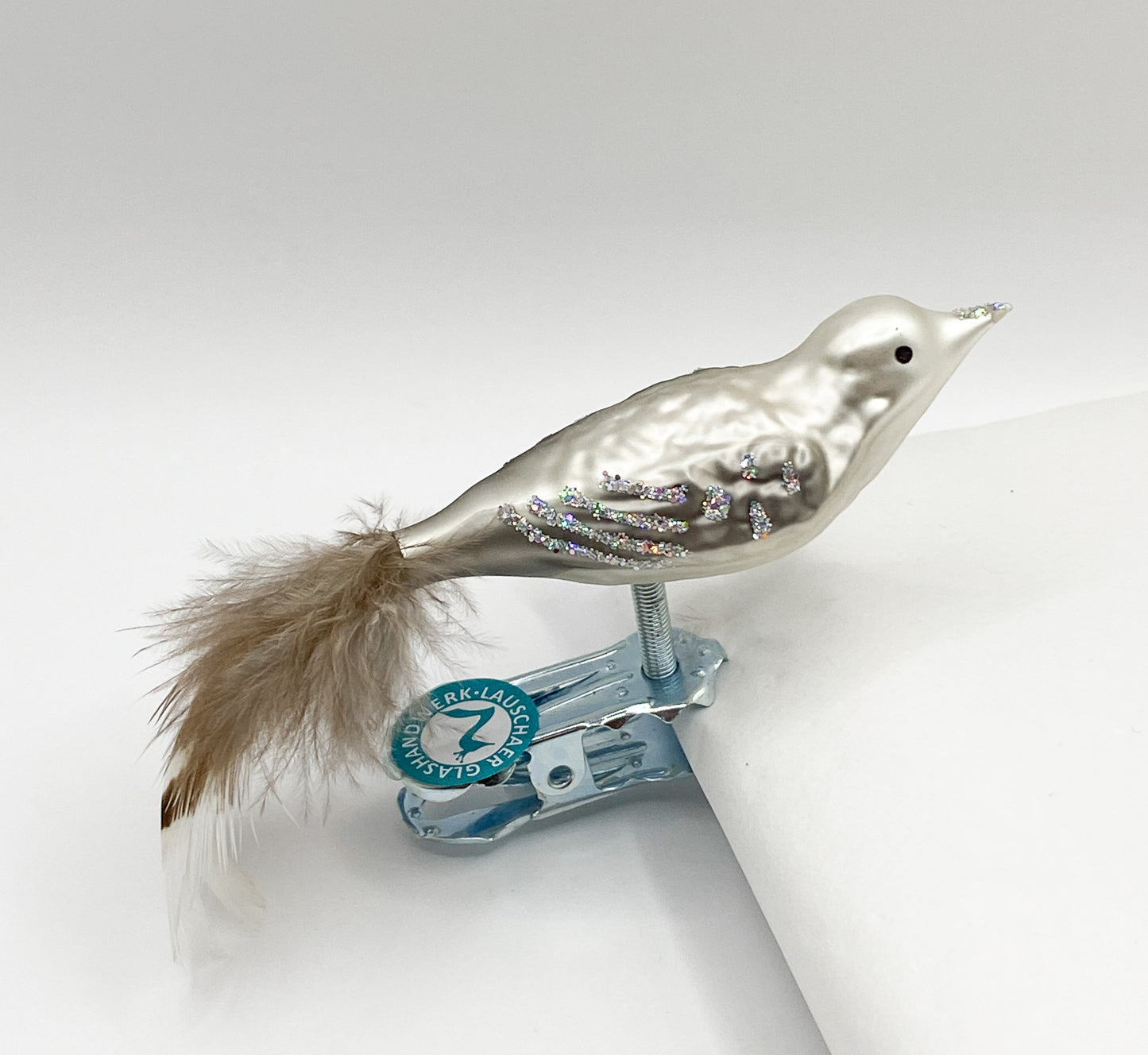 Small bird in warm grey with glitter