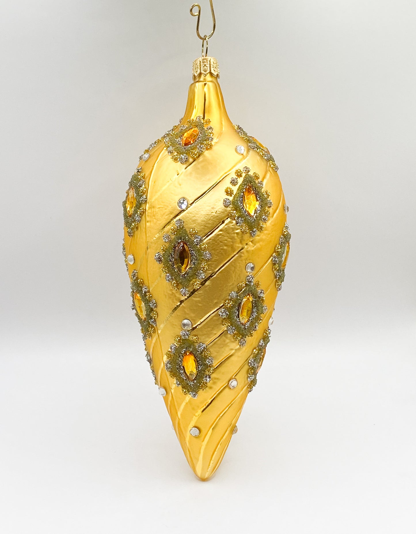 Golden baroque cone with golden gemstones