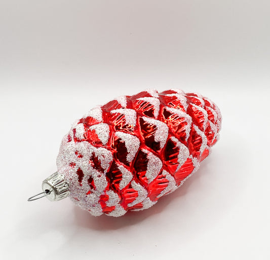Red shiny fir cone with white glitter