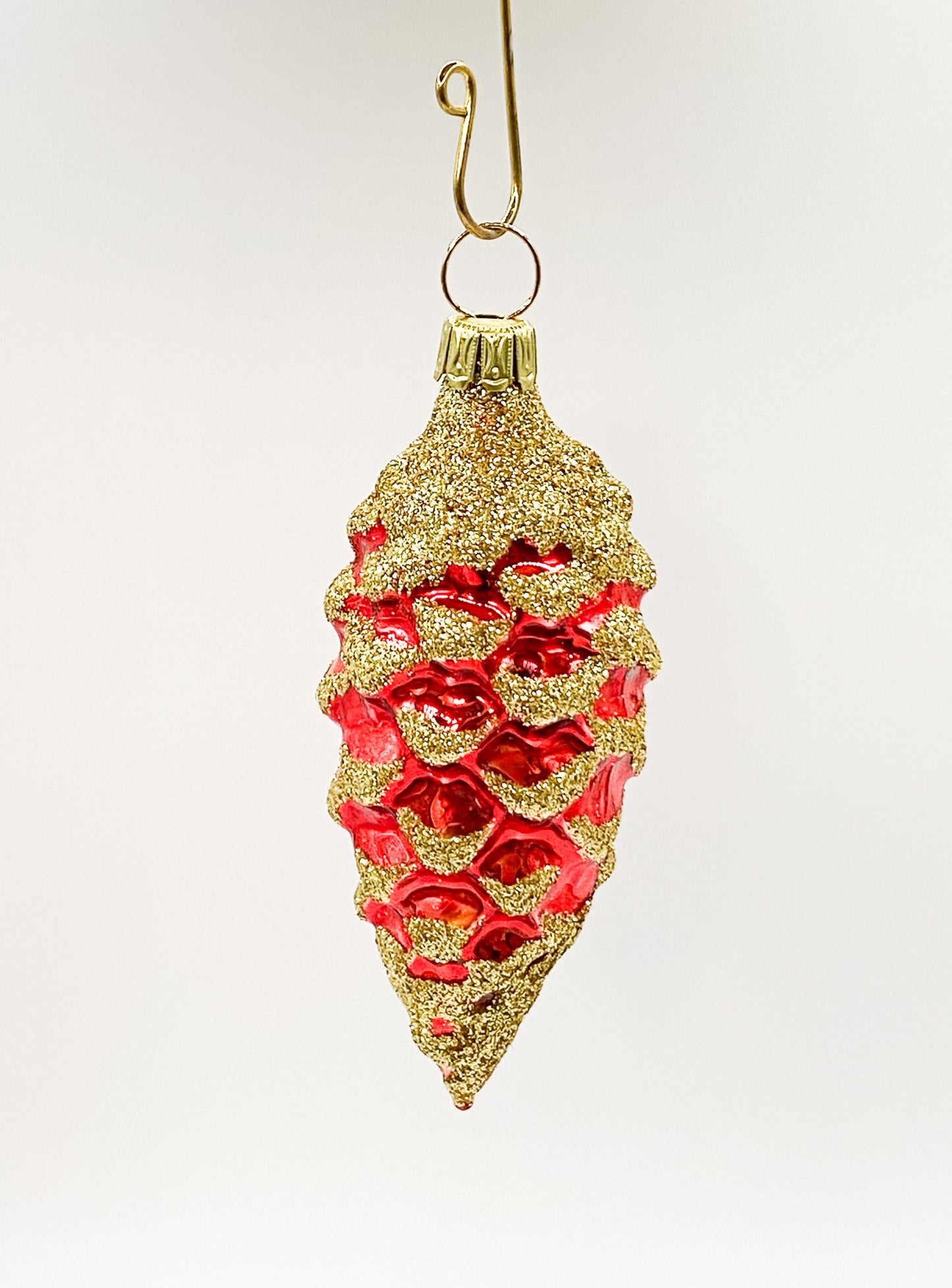 Small red cone with golden glitter