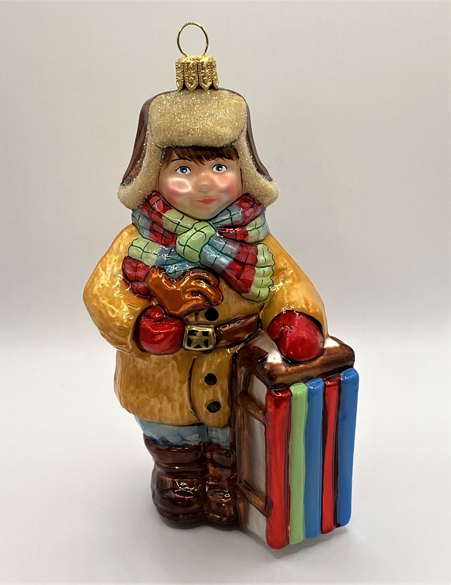 Baumschmuck-Christbaumschmuck-Junge-Pelzmuetze-Schlitten-weihnachts-deko-ch-Galerie-Luechinger-1