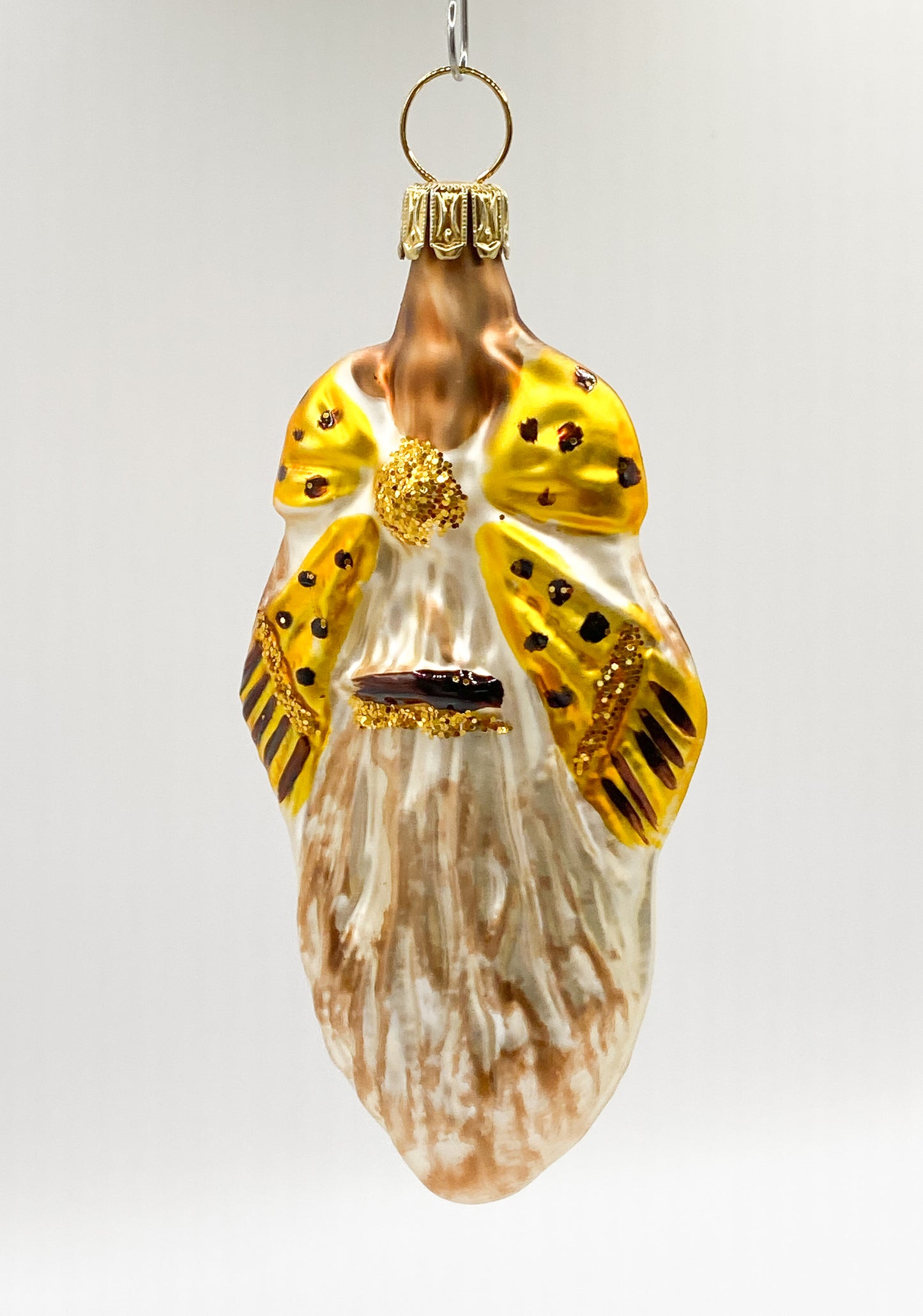 Fantasiekugel mit goldener Schleife