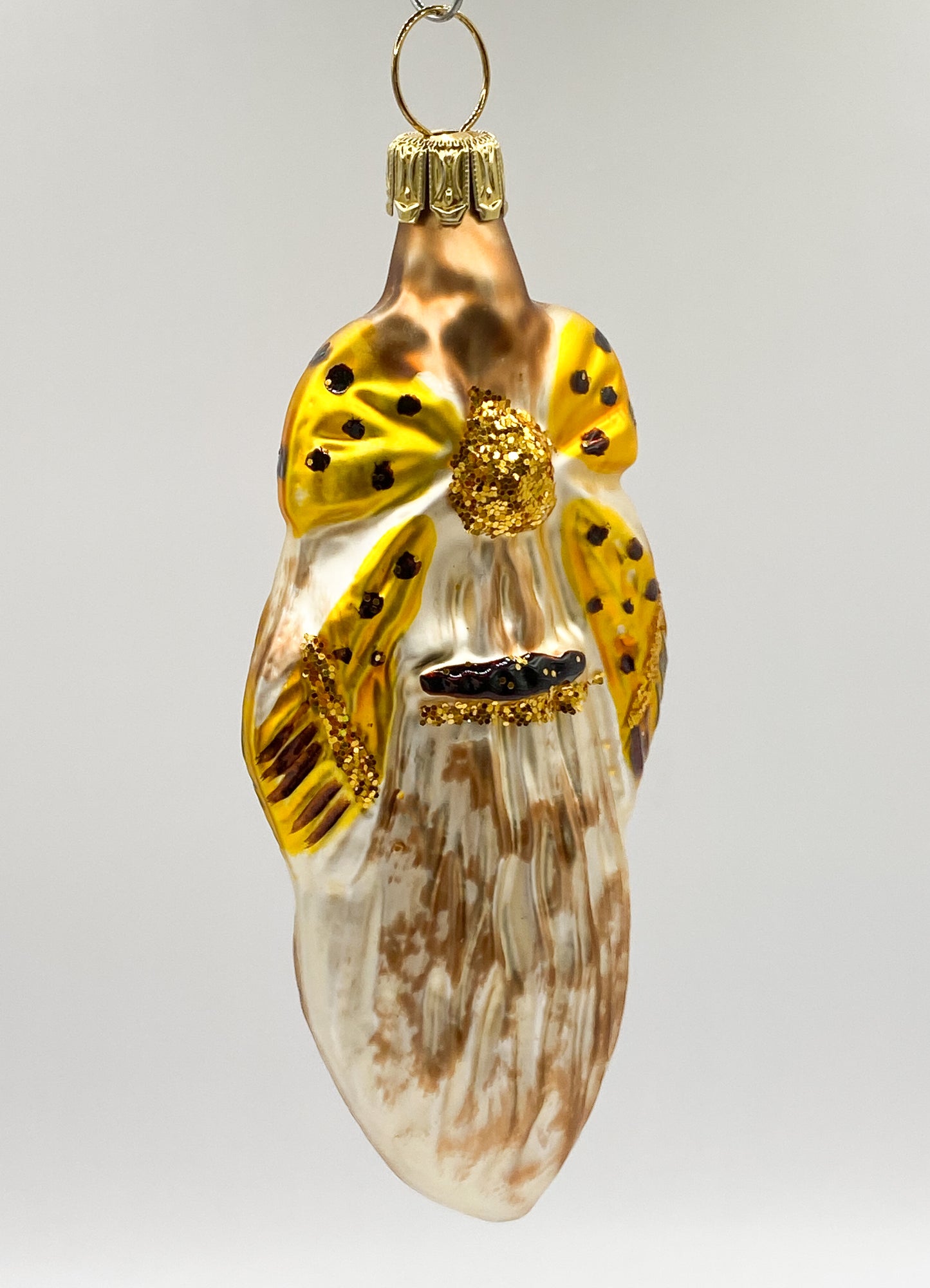 Fantasiekugel mit goldener Schleife