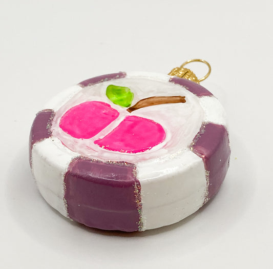 Bonbon mit pinkem Apfel-Motiv