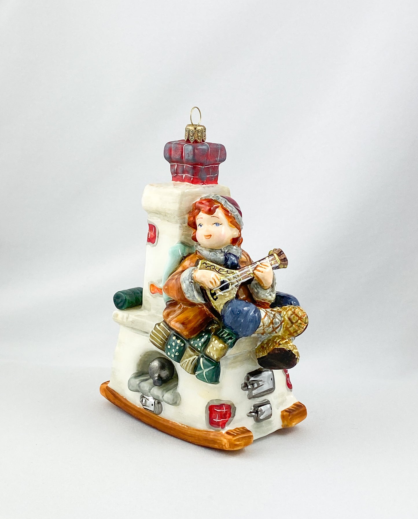 Emil sits on the stove bench and plays the balalaika, AtlasArt