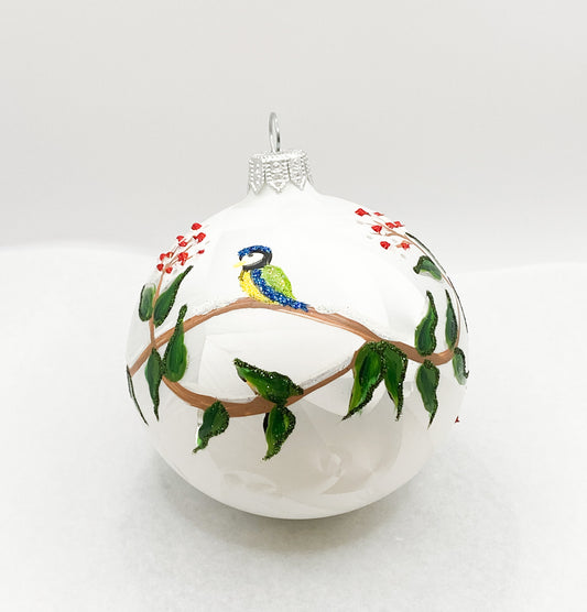 White ball with blue tits on leaf tendrils
