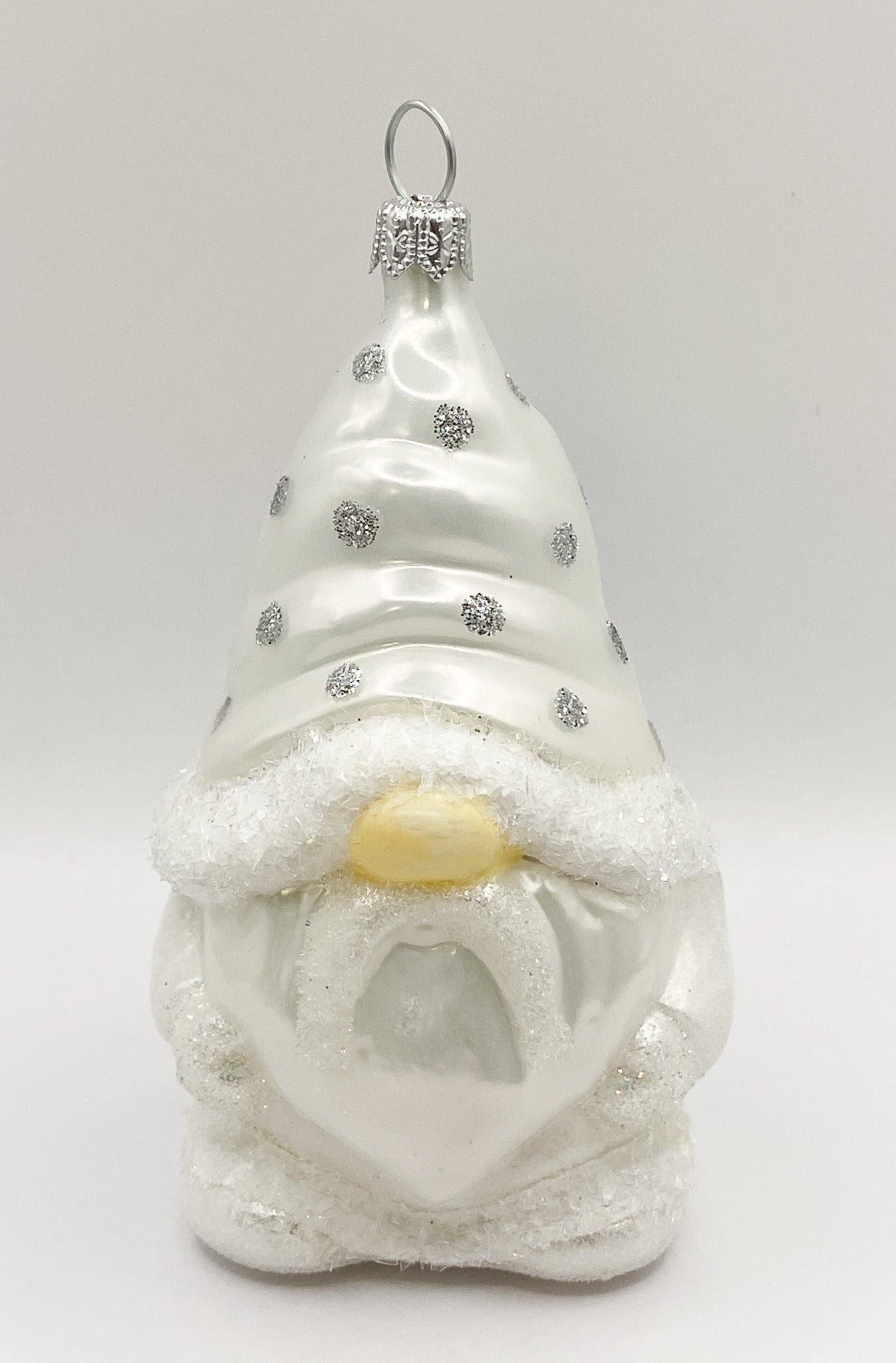 Gnome in white spotted robe