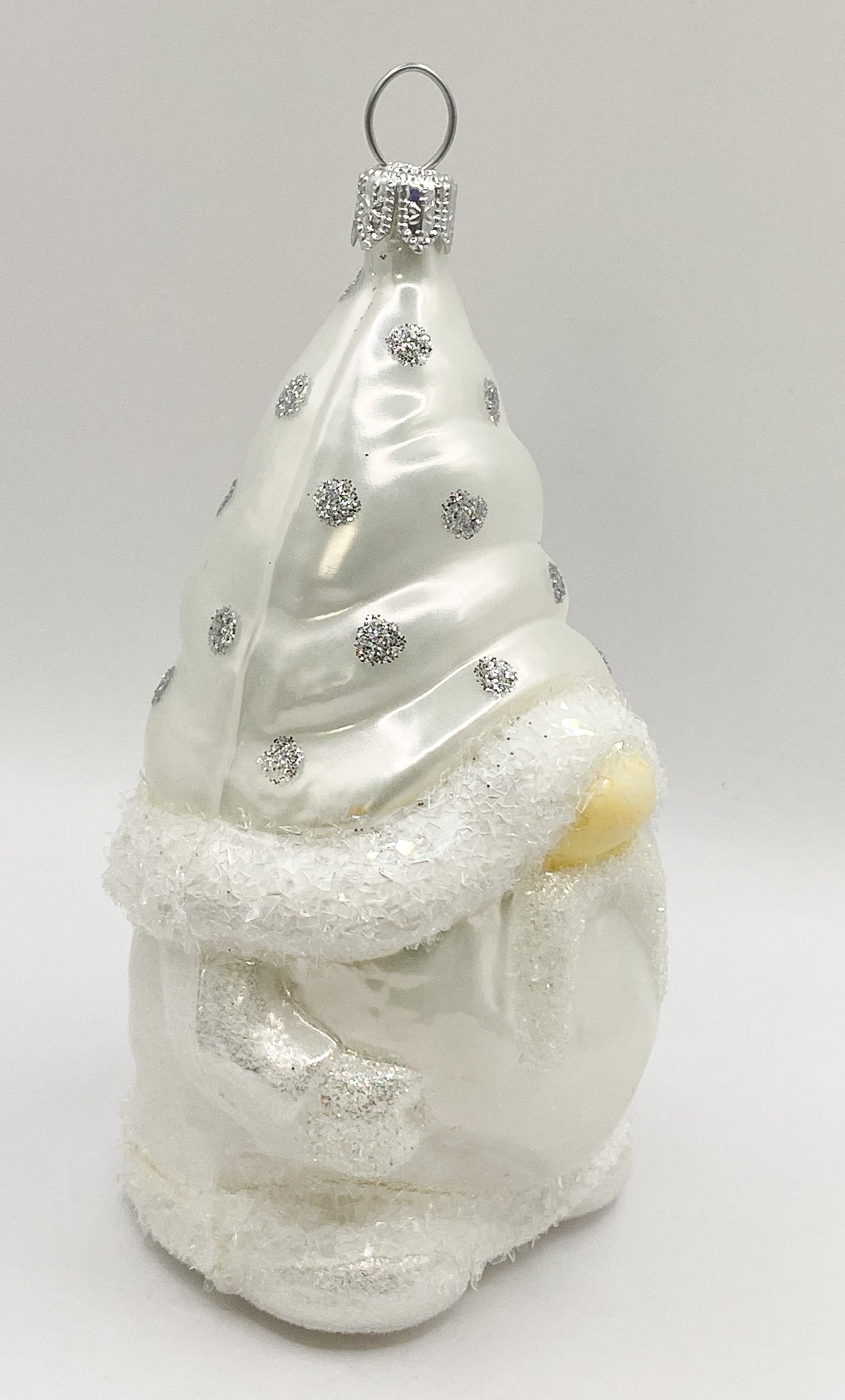 Gnome in white spotted robe