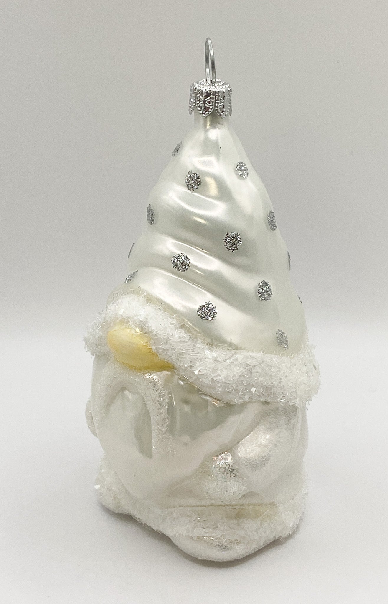 Gnome in white spotted robe