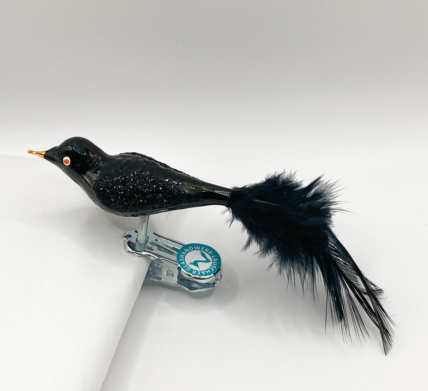 Kleine Glitzer-Amsel