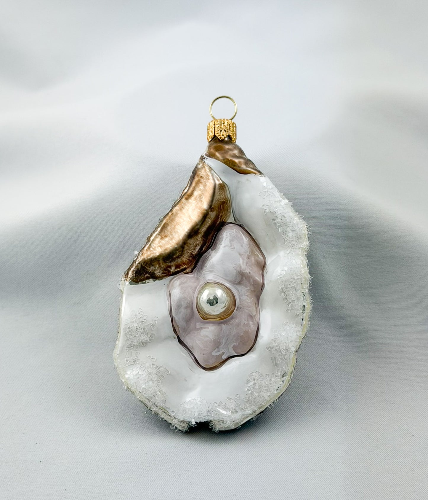 Large open oyster with pearl