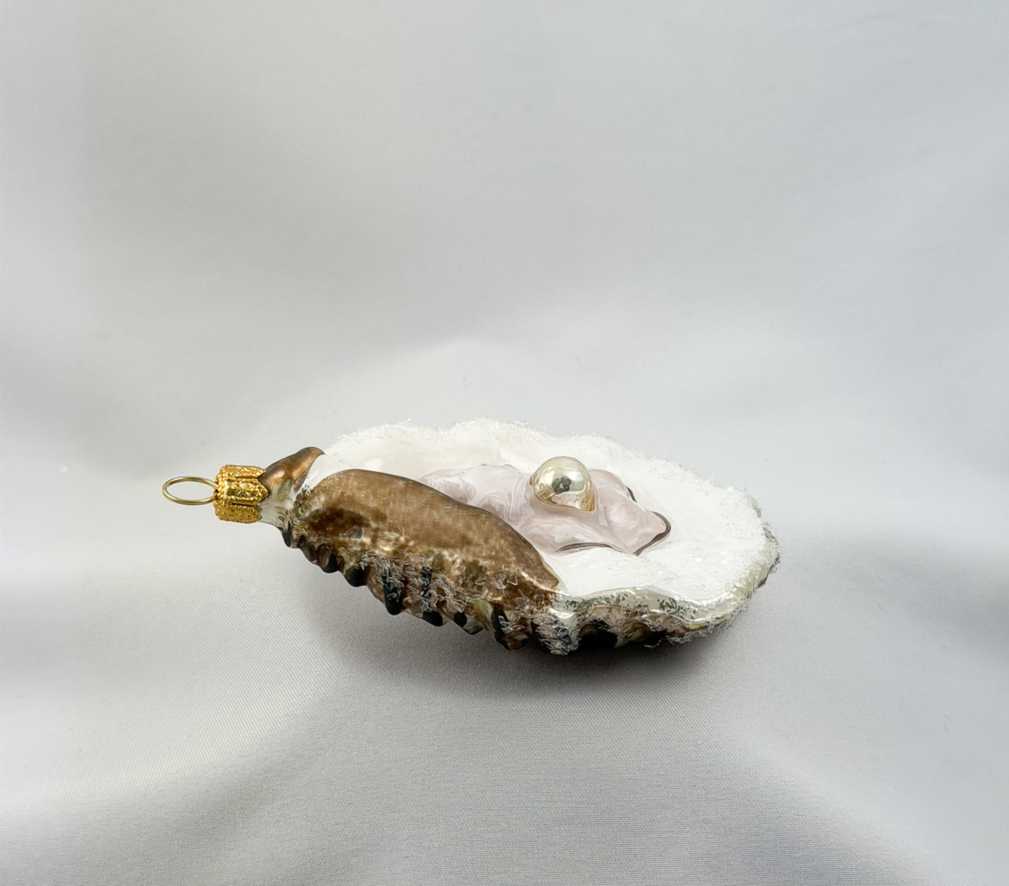 Large open oyster with pearl