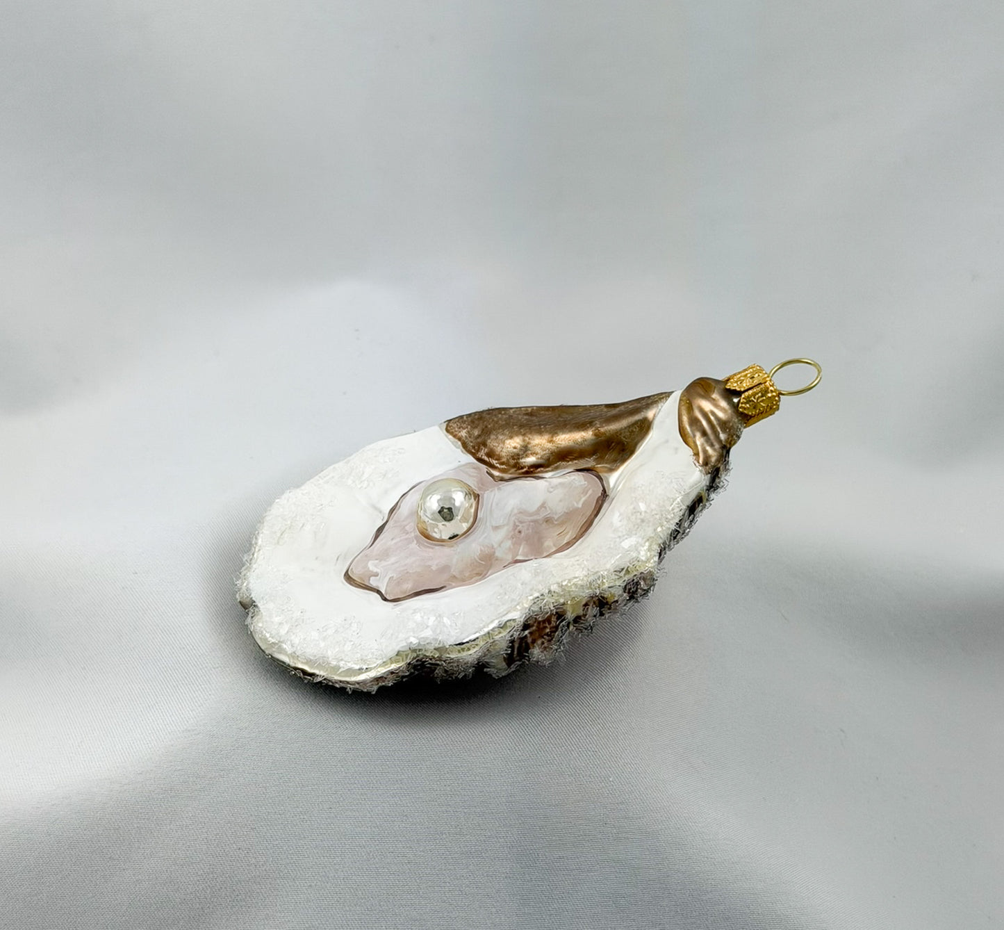Large open oyster with pearl