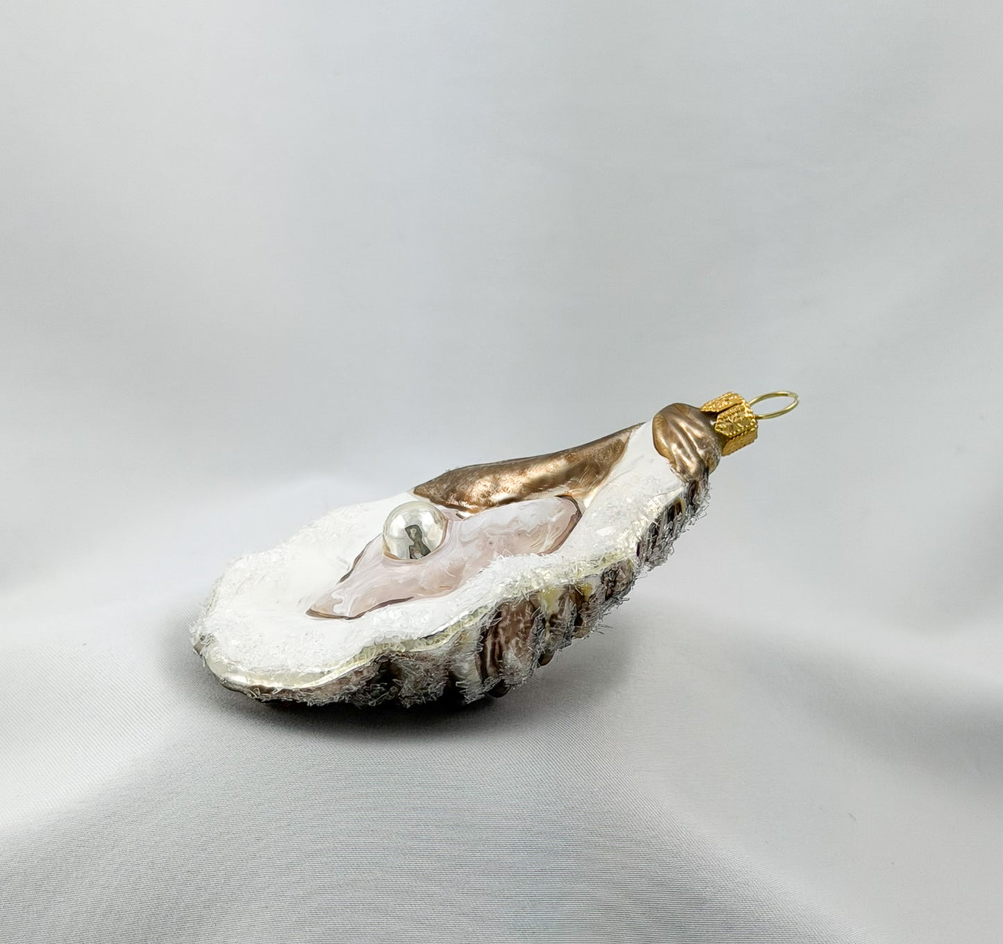 Large open oyster with pearl