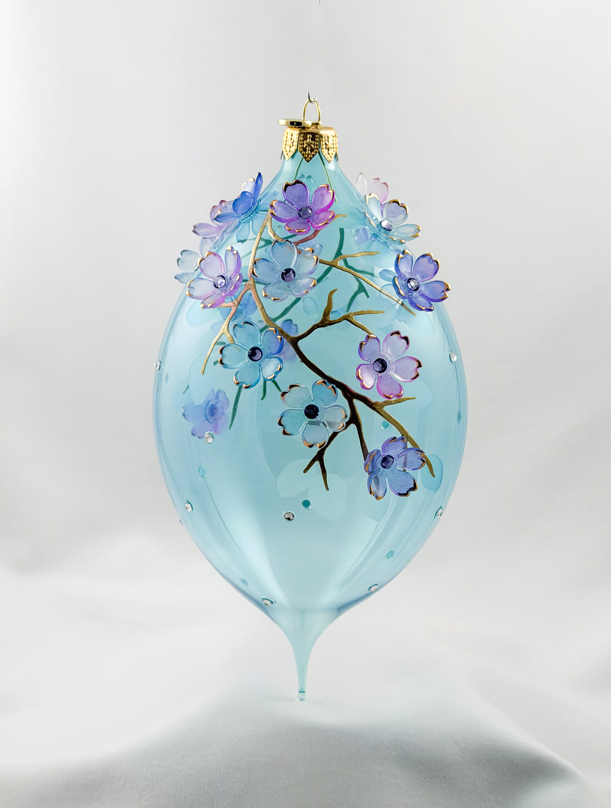 Grosse Tropfenform in Hellblau transparent mit vielen Blüten, GlitterLab