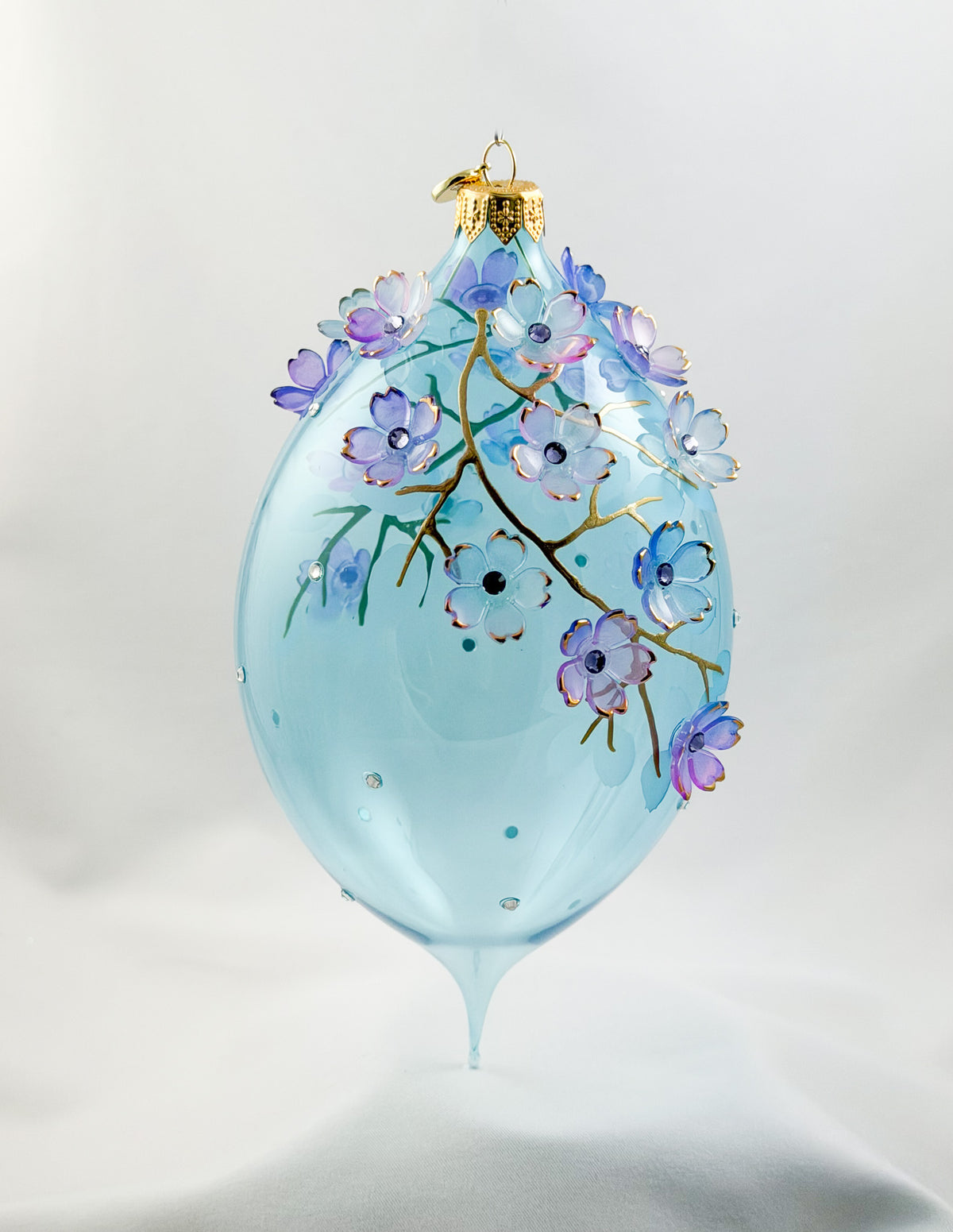 Grosse Tropfenform in Hellblau transparent mit vielen Blüten, GlitterLab