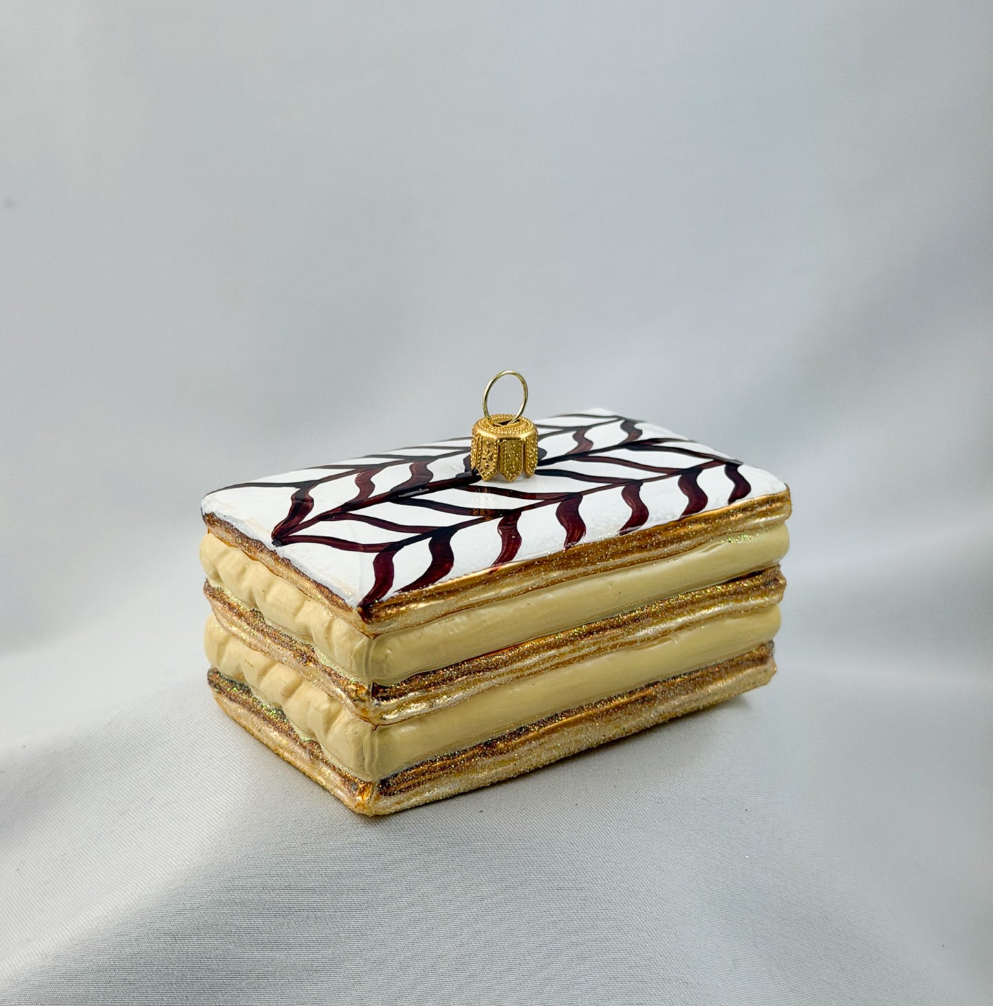 Cream slice with icing and chocolate decoration