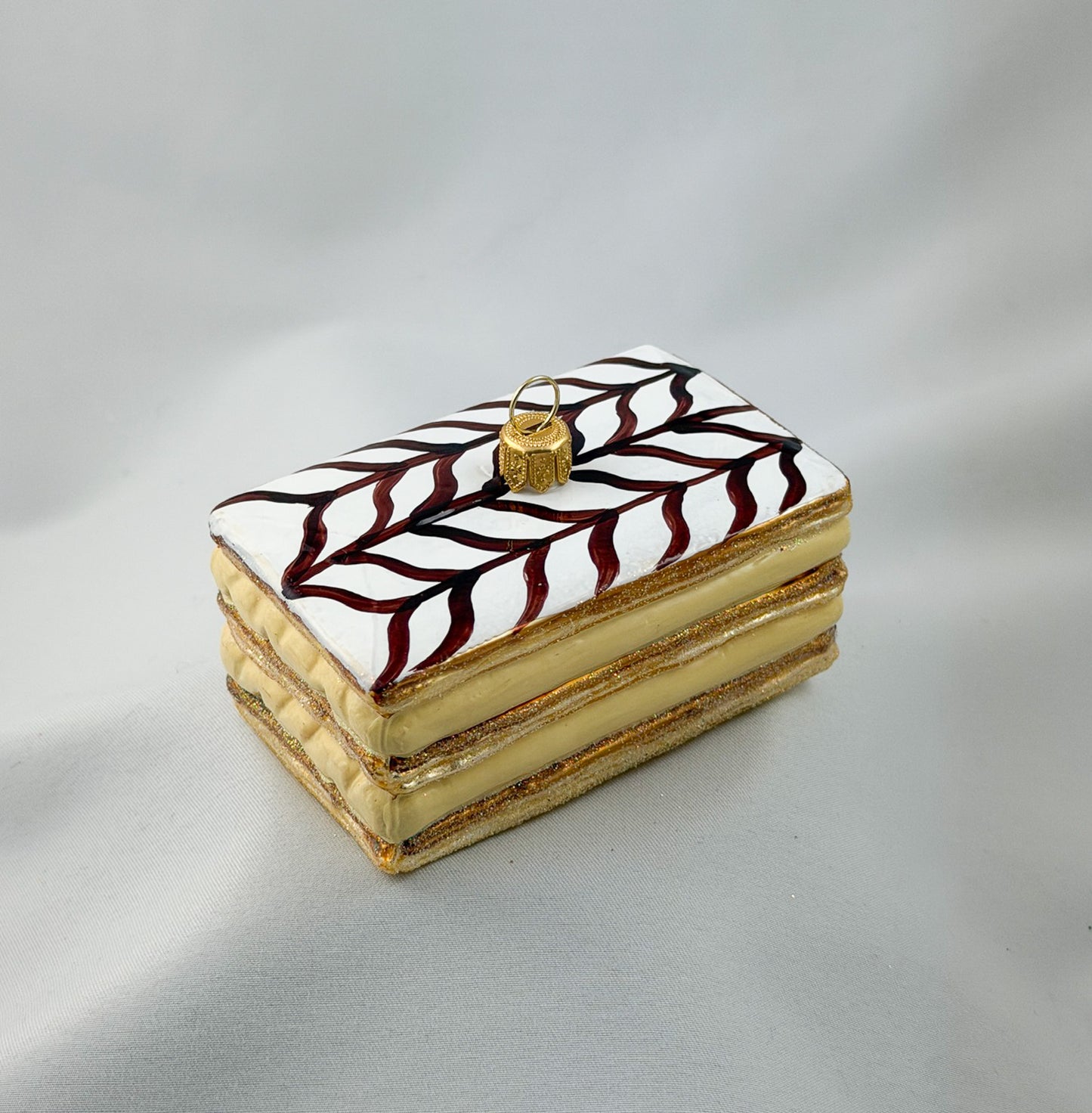 Cream slice with icing and chocolate decoration