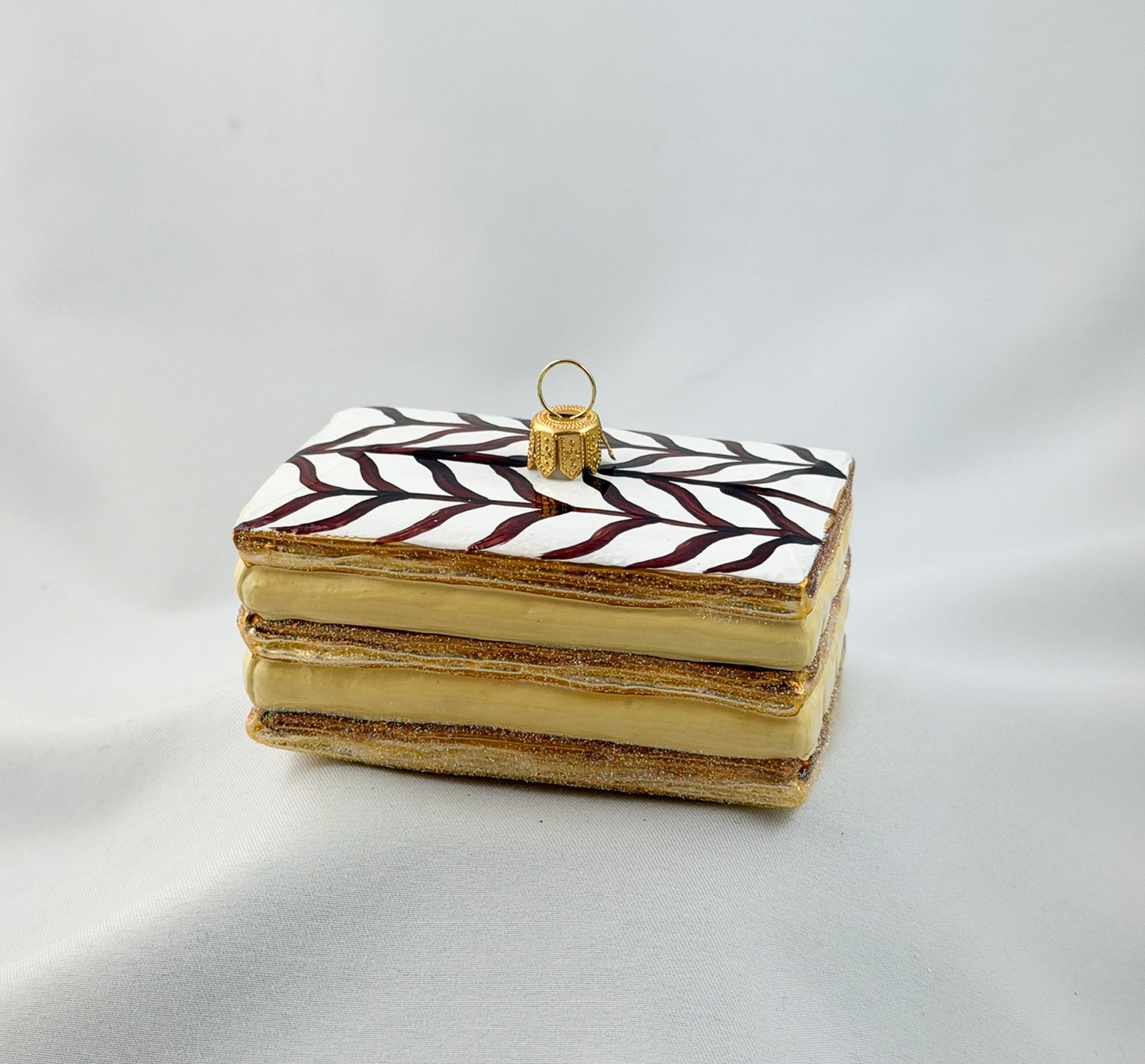 Cream slice with icing and chocolate decoration